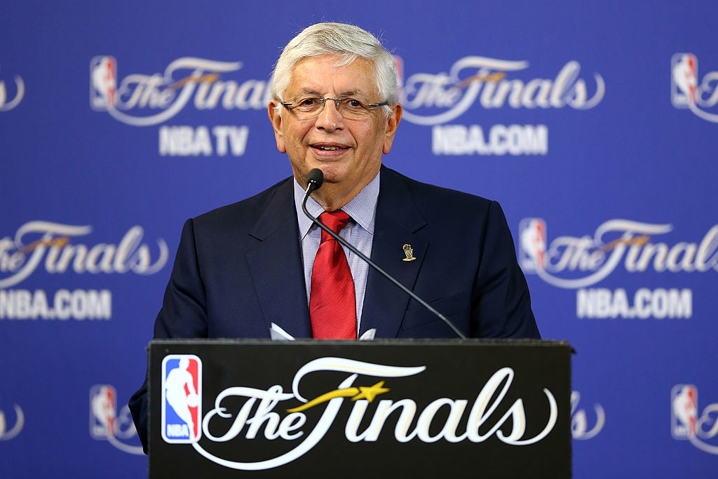 An authoritative  speaking astatine  an NBA Finals property   conference, lasting  down  a podium with "The Finals" logo