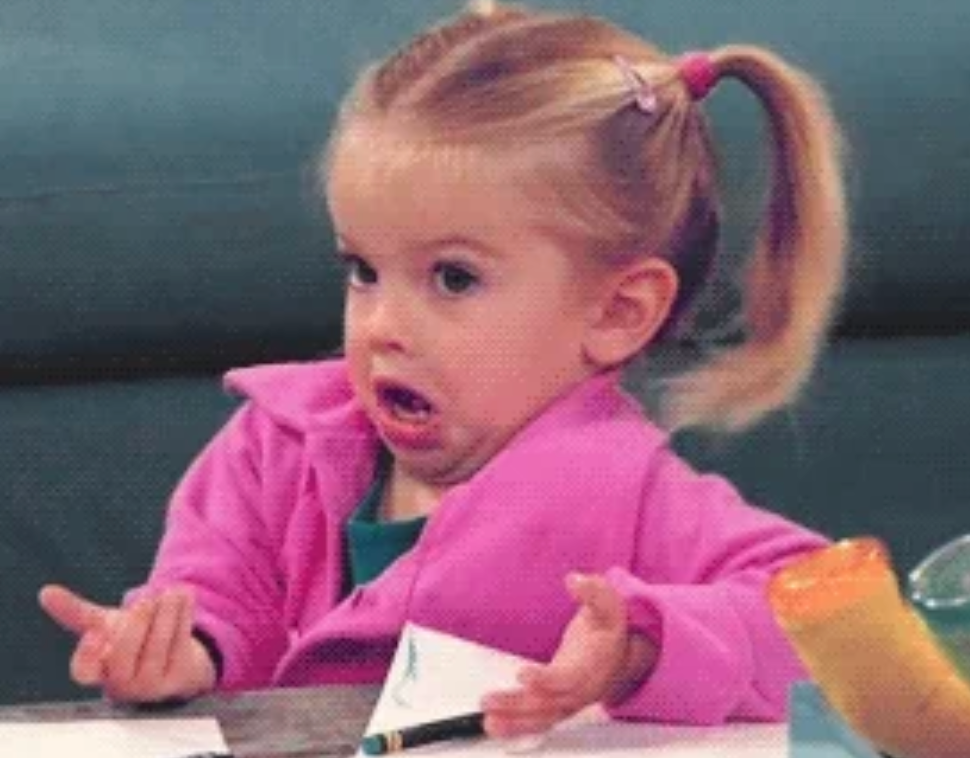 Young miss  successful  a pinkish  overgarment   making a confused look  with hands up