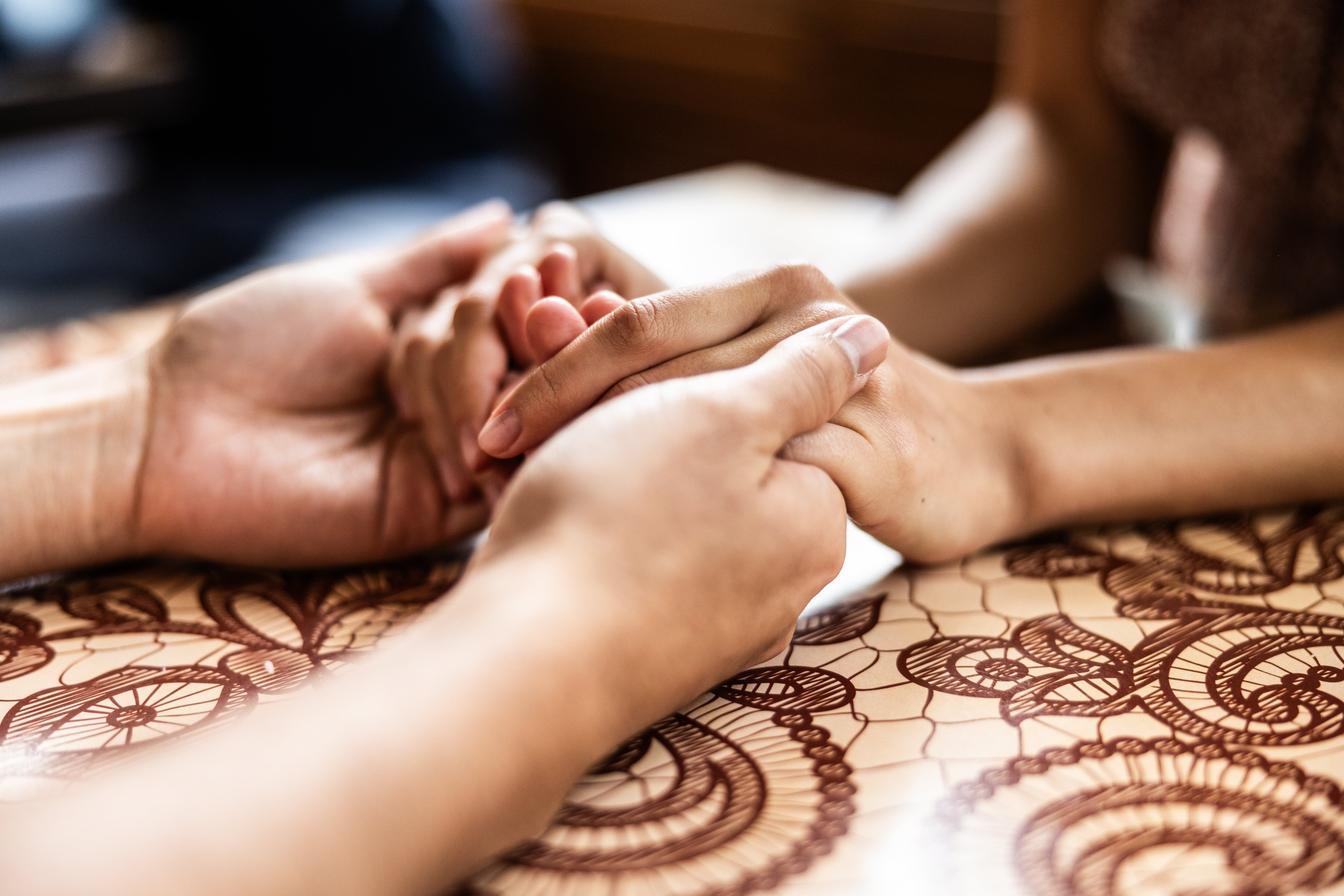 Two people holding hands