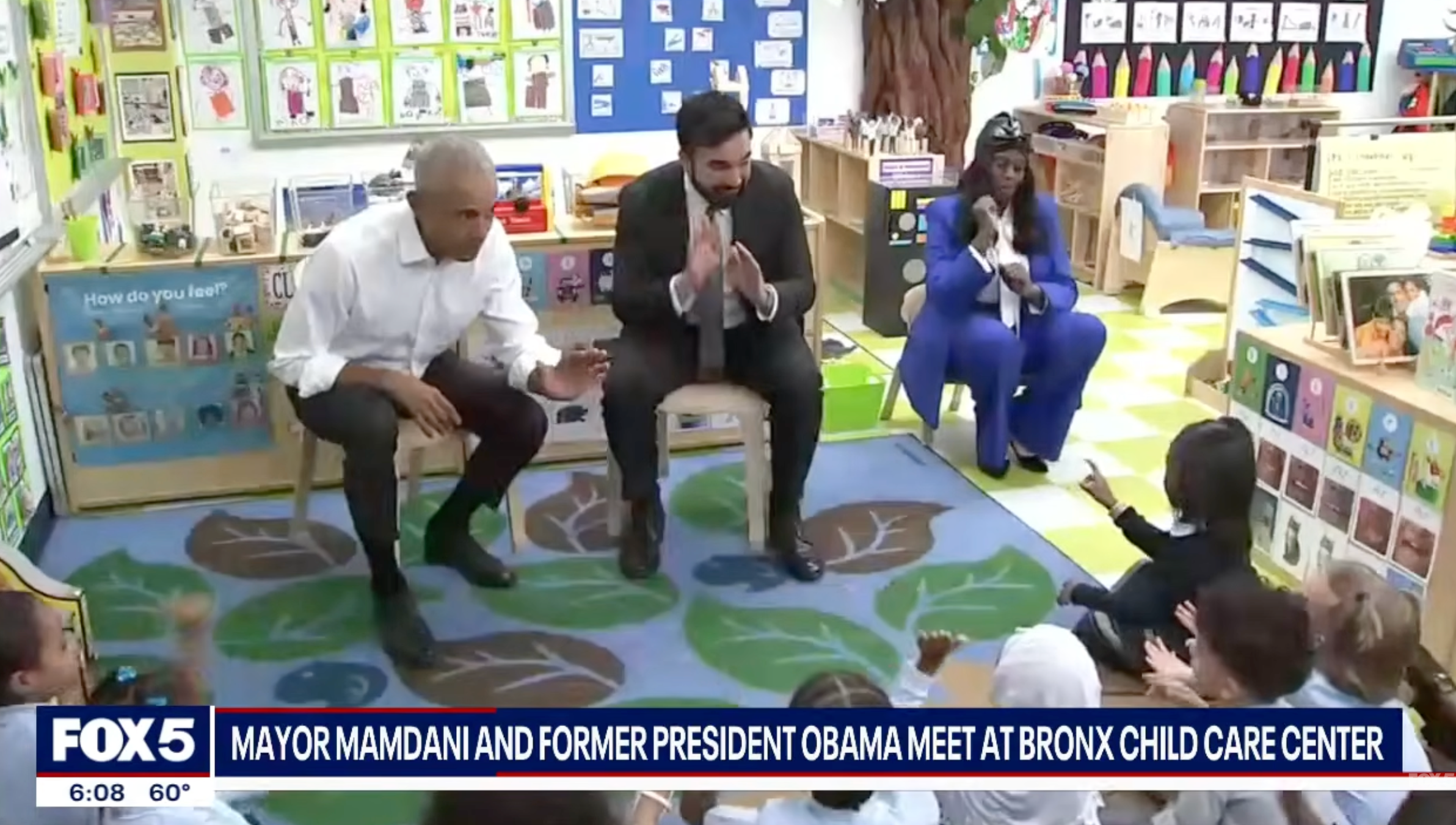 Former President Obama claps with children during a sojourn  to a Bronx kid  attraction   center, seated with Mayor Mamdani