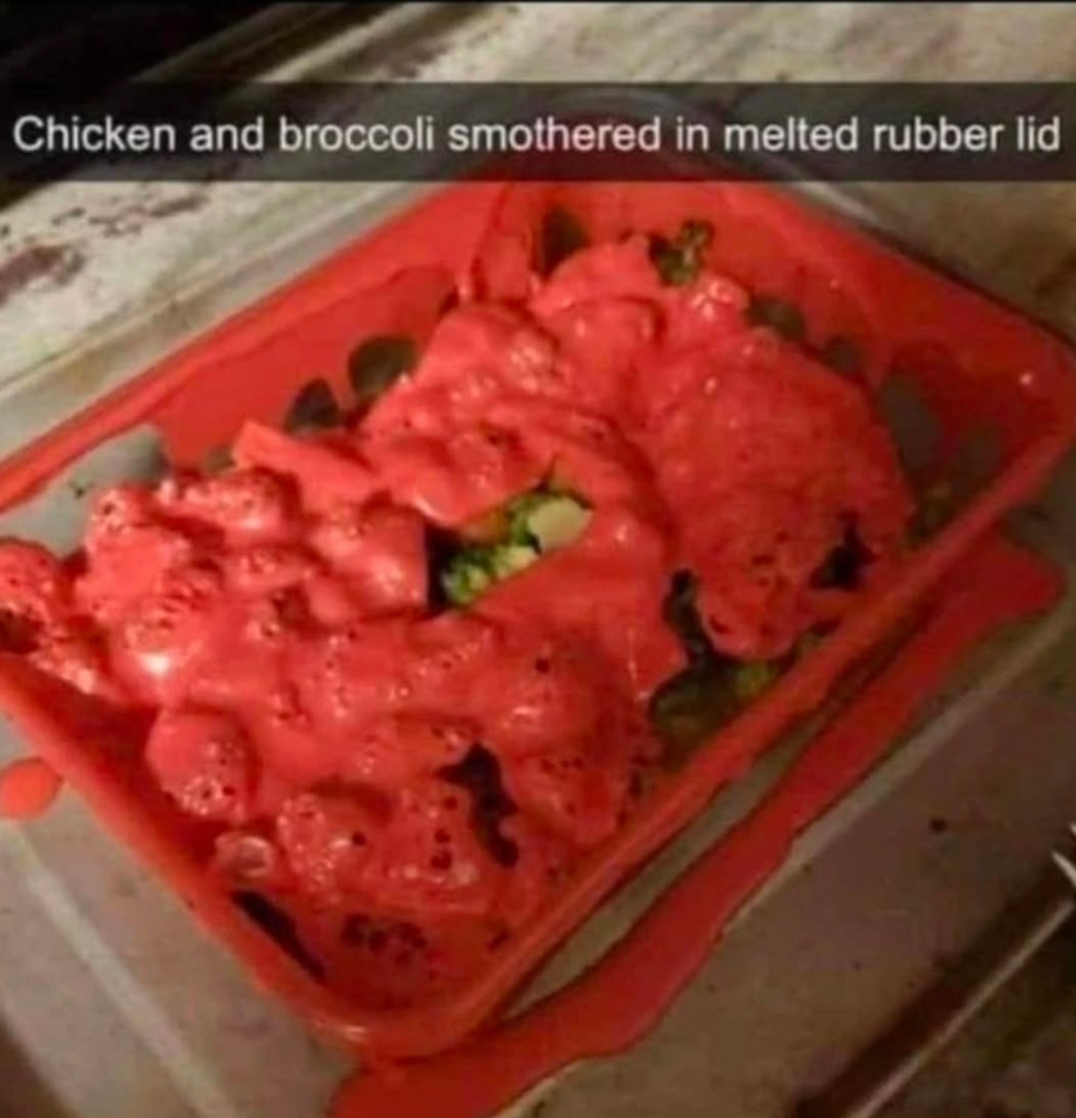 Chicken and broccoli covered in melted red rubber from a microwave mishap