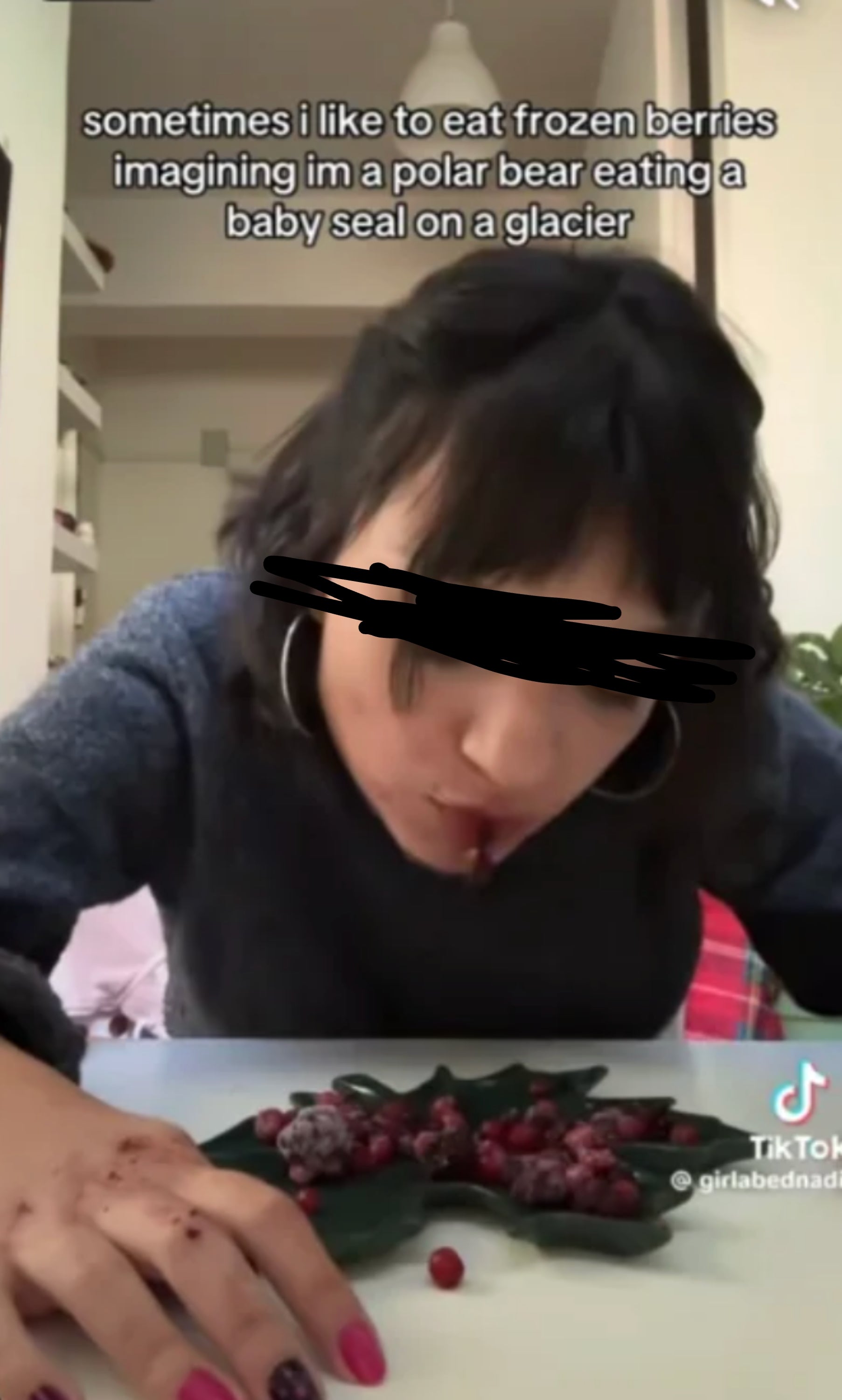 Person humorously eating frozen berries from a leaf, with text imagining they're a polar bear on a glacier