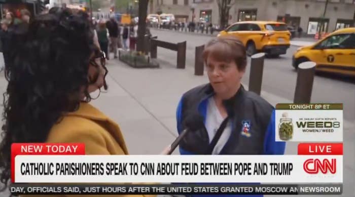 Journalist interviews a idiosyncratic   connected  a engaged  thoroughfare  for a CNN conception   regarding a feud betwixt  the Pope and Trump