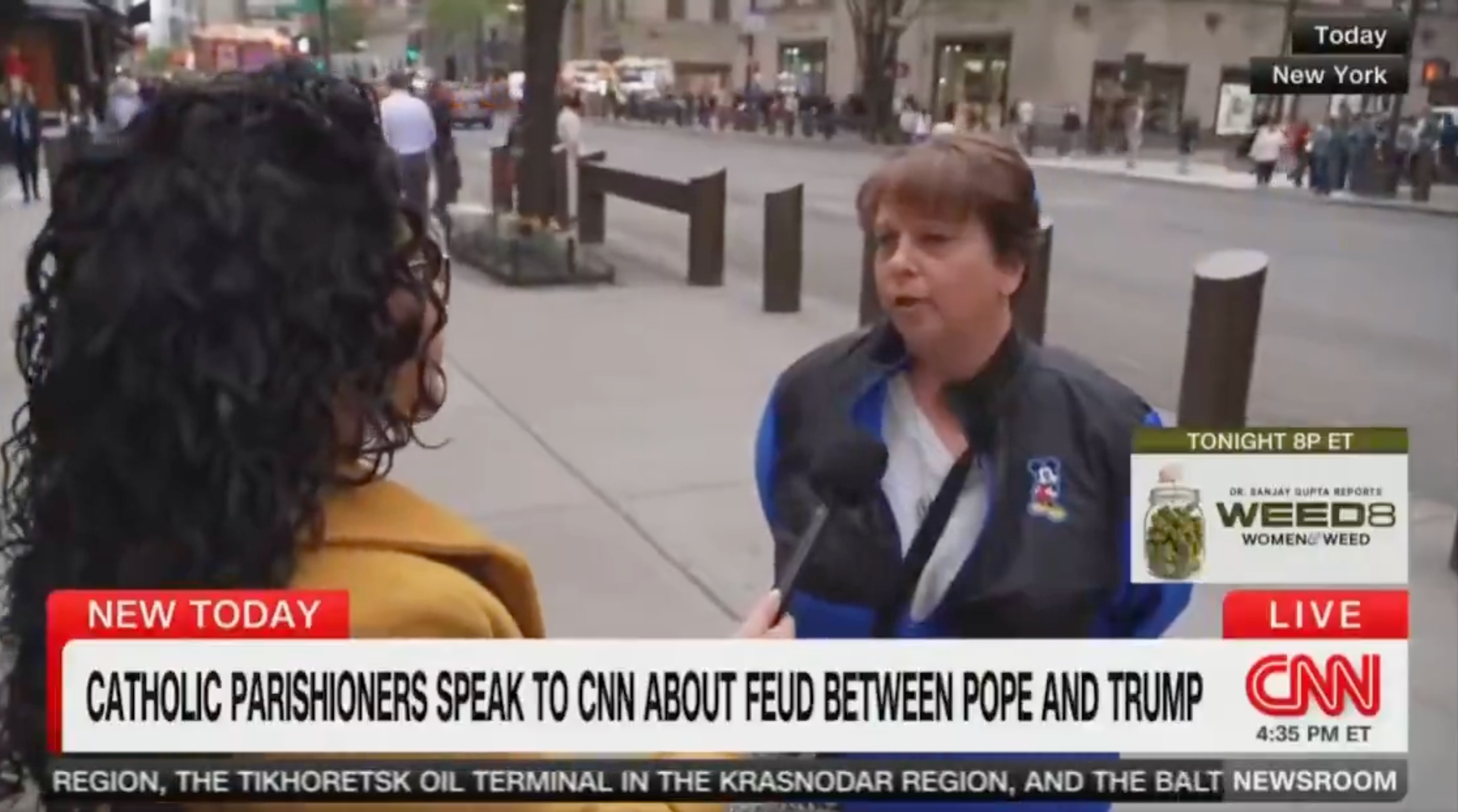 A pistillate   is interviewed by a newsman  connected  a metropolis  street. CNN header  discusses Catholic parishioners speaking astir  a feud betwixt  the Pope and Trump