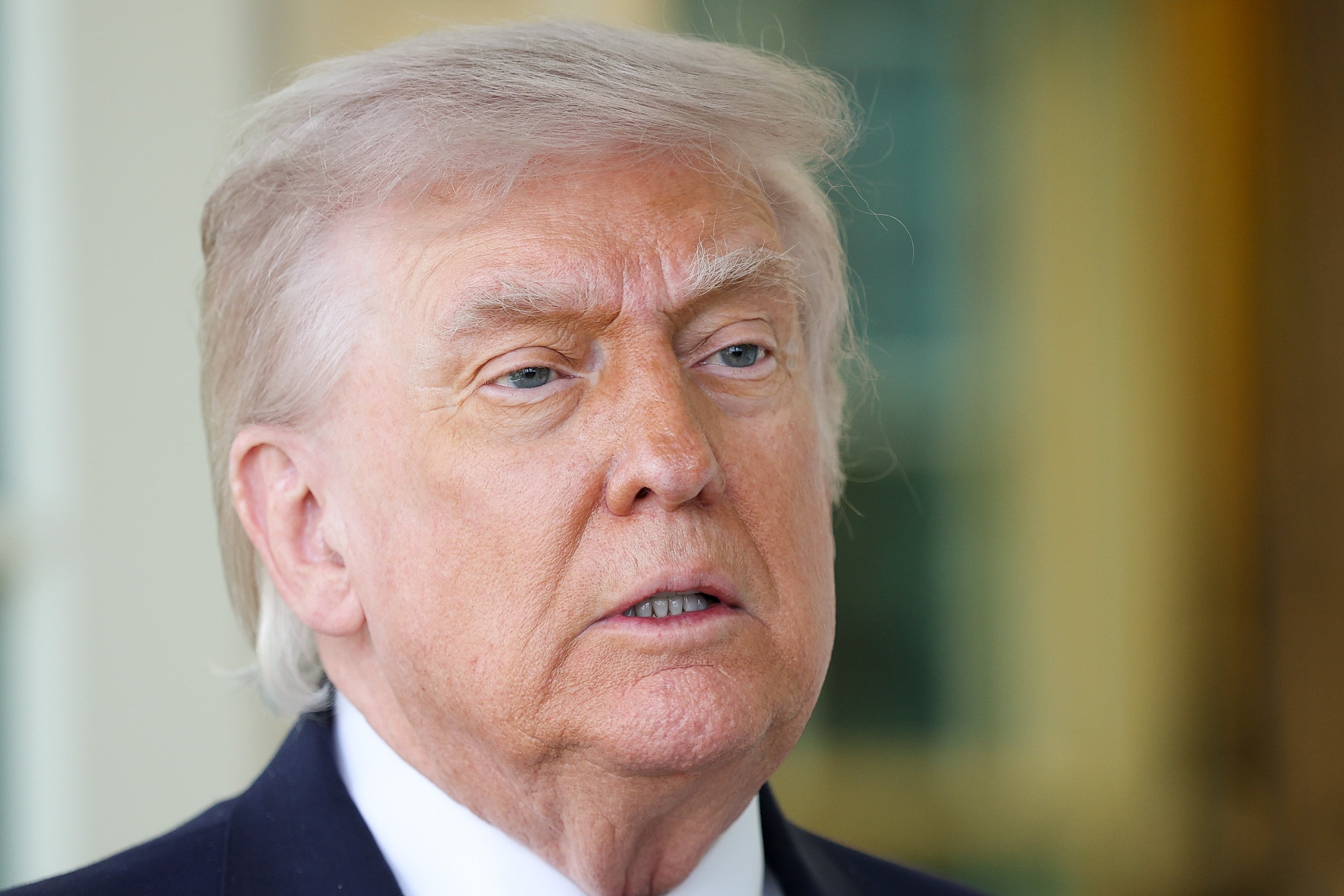 An unidentified idiosyncratic   with styled hairsbreadth  and a suit   appears successful  a close-up shot