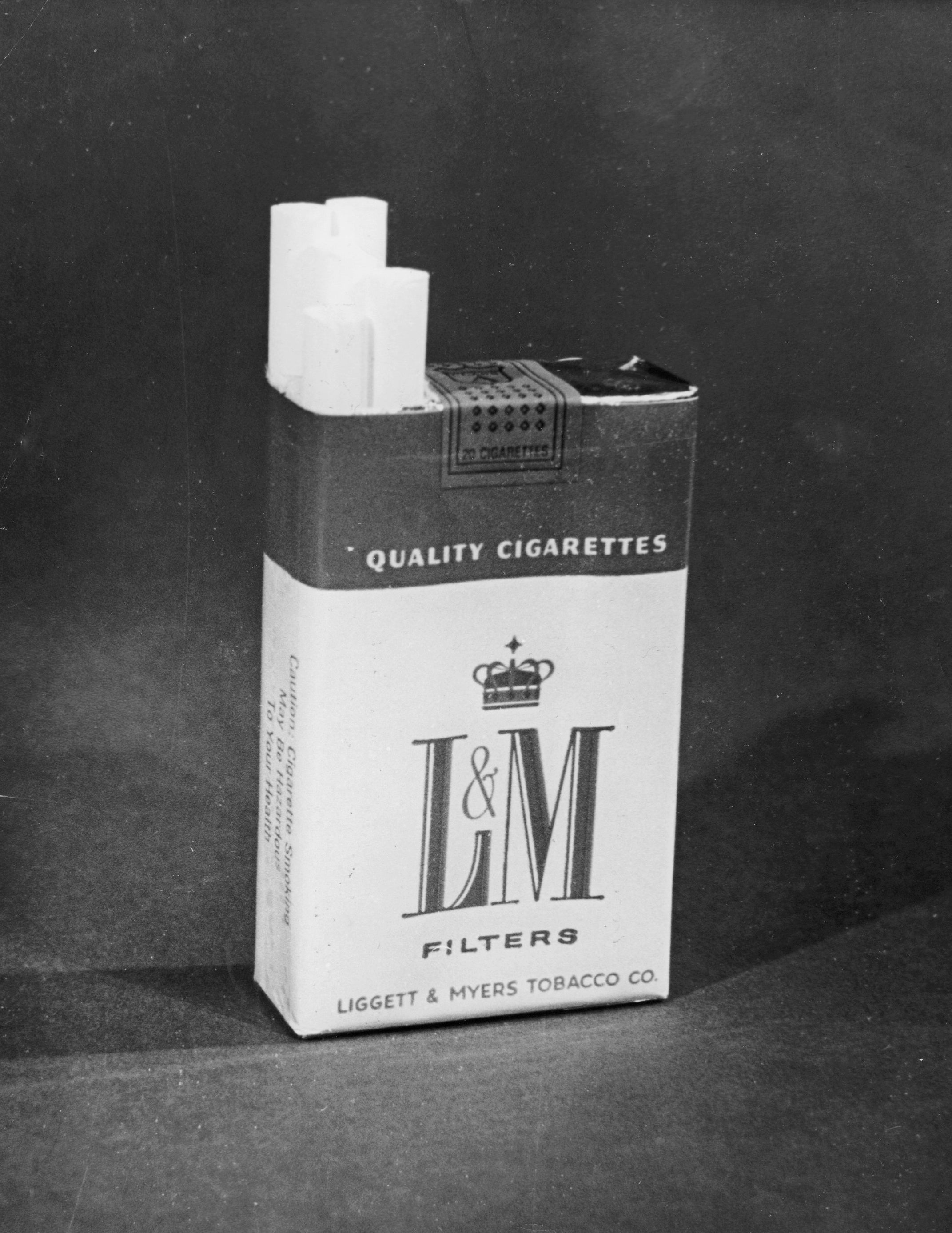 Pack of L&amp;amp;M Filters cigarettes with filter tips visible, marked "Quality Cigarettes," by Liggett &amp;amp; Myers Tobacco Co