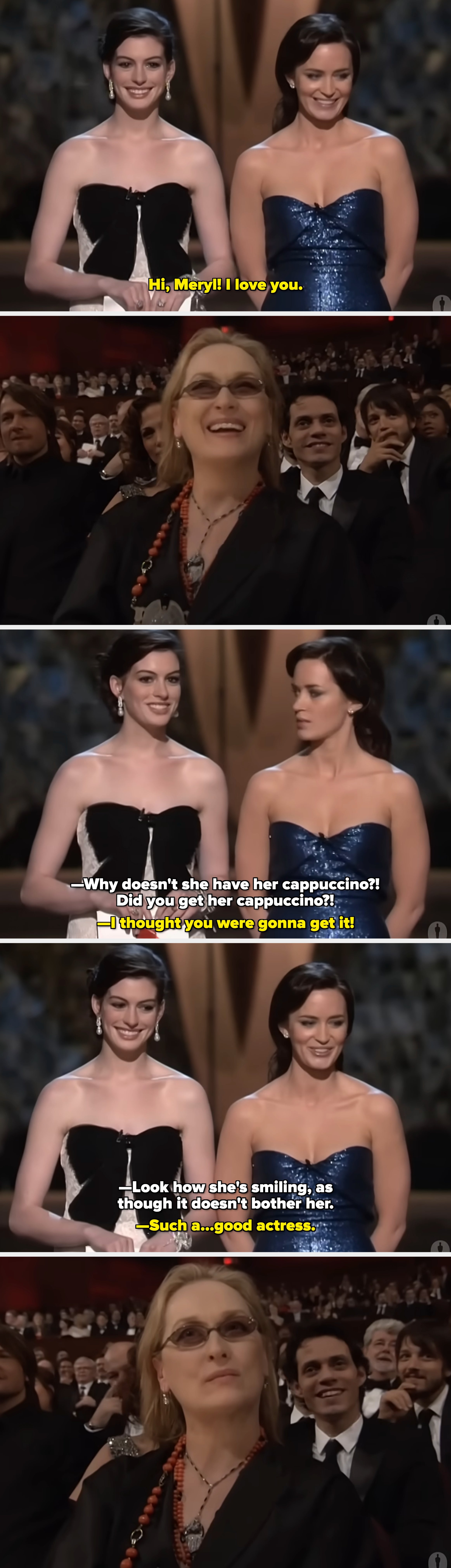 Two women connected  stage, 1  successful  a strapless black-and-white gown and the different   successful  a strapless shimmering gown, some  smiling