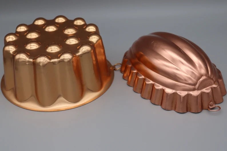 Two vintage copper gelatin molds, 1  with a scalloped plan  and the different   ribbed