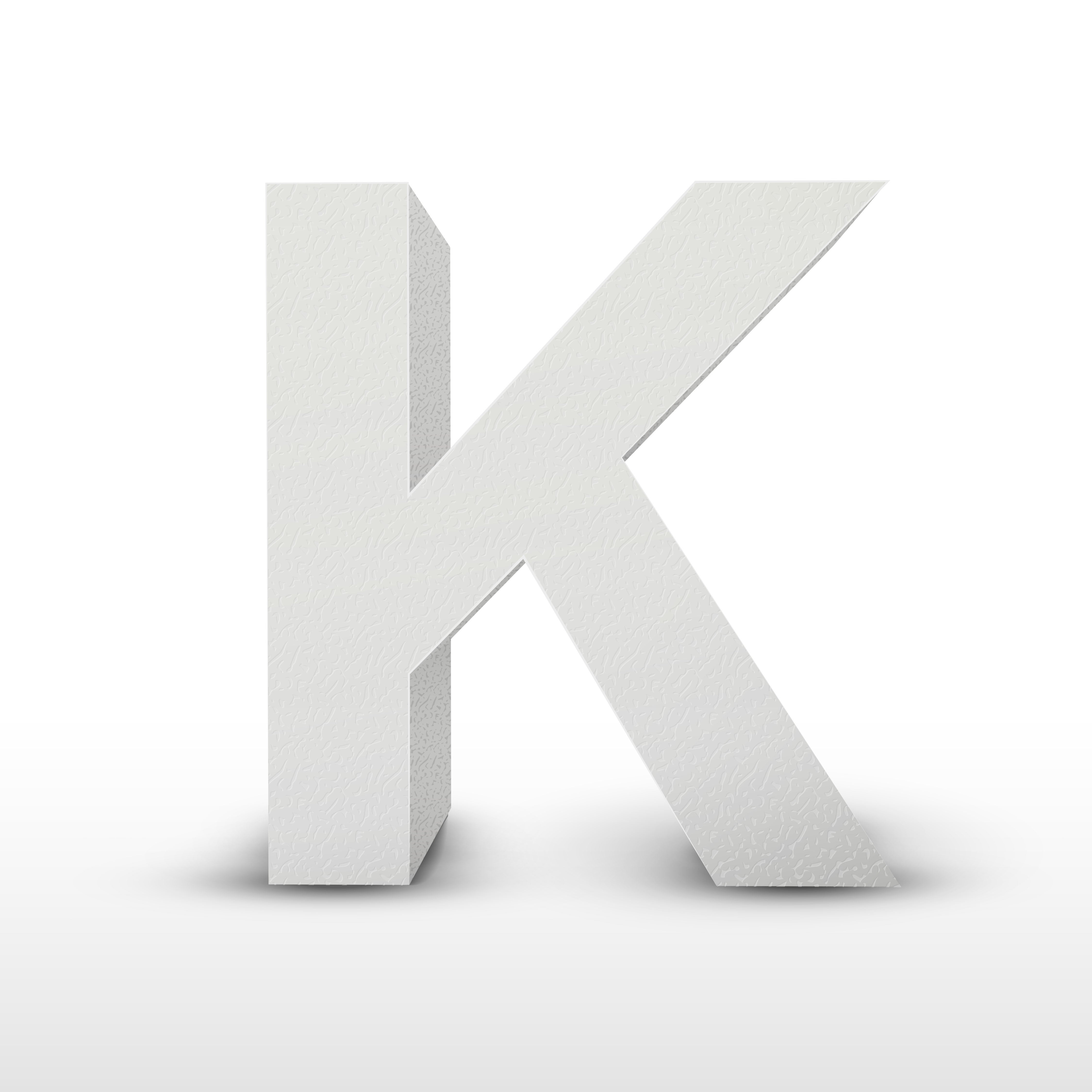 The representation  shows a large, textured 3D missive  "K" lasting  upright connected  a plain background