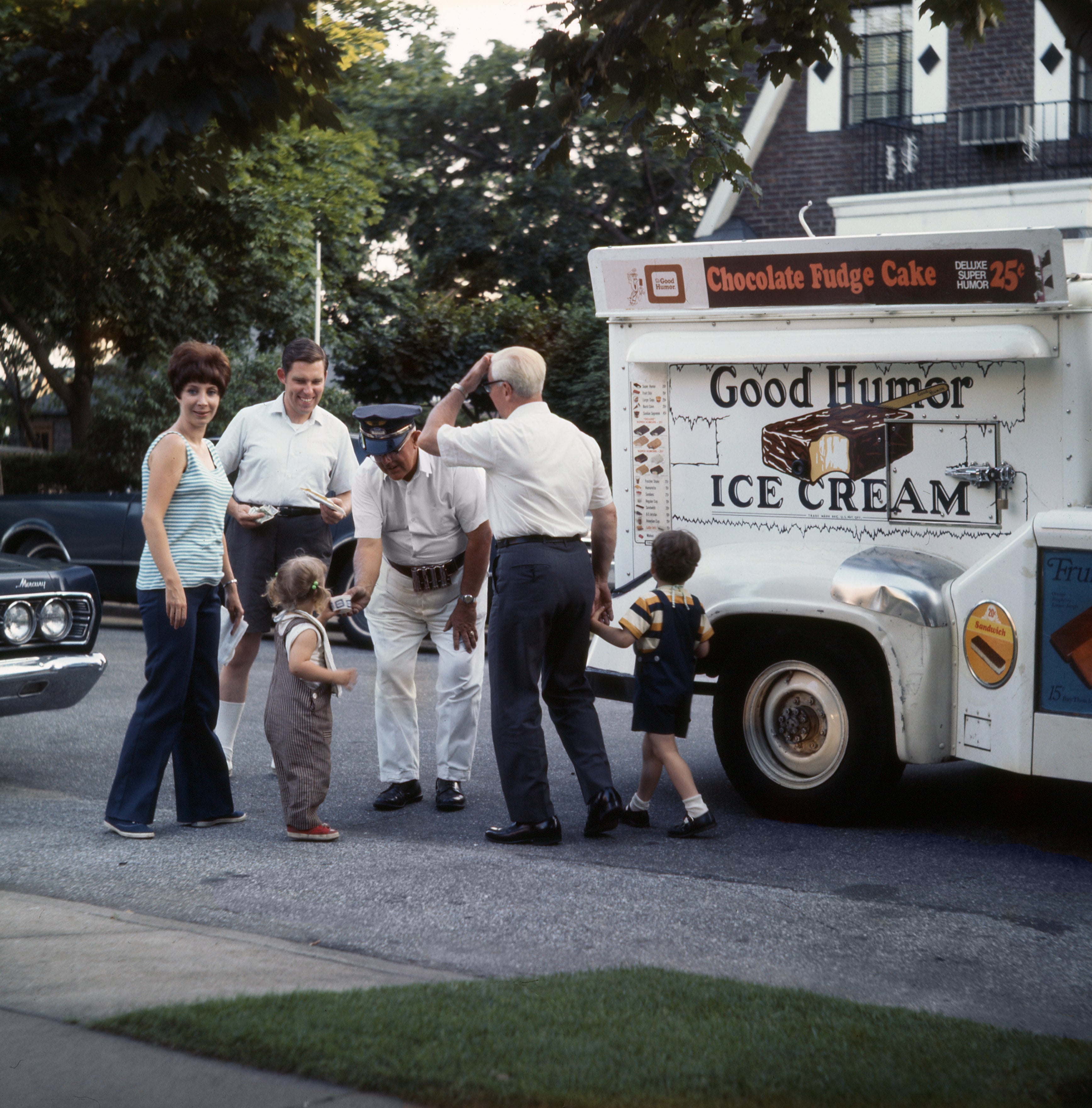 A nostalgic country   with radical   gathered astir   a vintage crystal  pick  motortruck  connected  a residential street, children eagerly waiting for treats