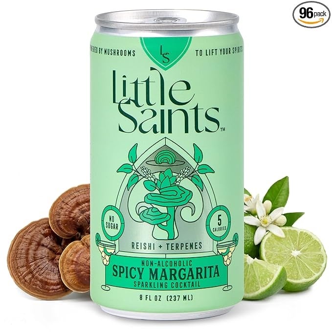 Can of Little Saints Spicy Margarita, non-alcoholic sparkling cocktail with reishi and terpenes, no sugar, 5 calories. Lime and mushrooms in background