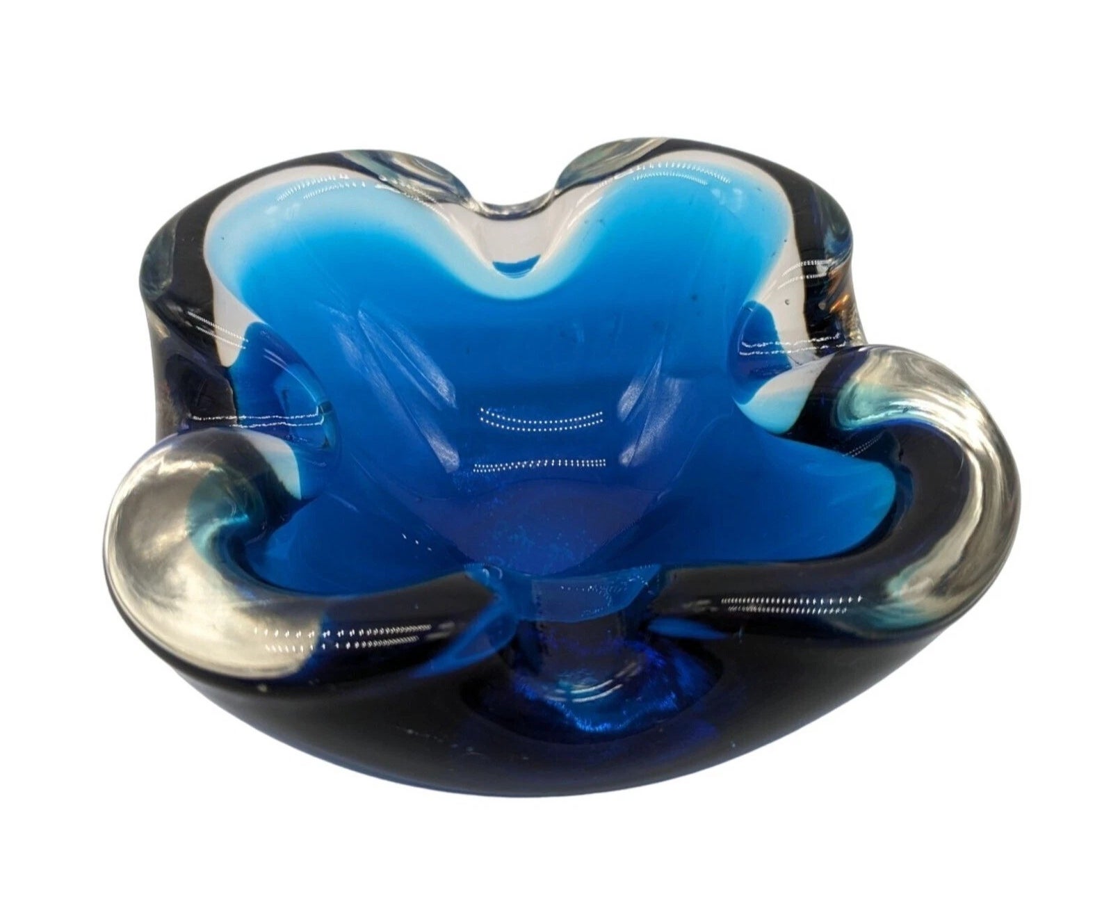 Glass ashtray with a swirling design, featuring a premix  of bluish  and wide   glass