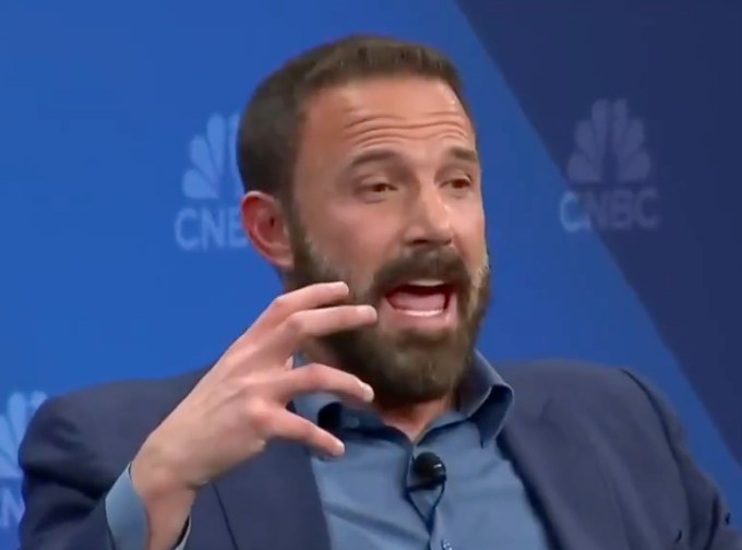 A antheral   successful  a suit   gestures expressively portion    speaking astatine  a CNBC event