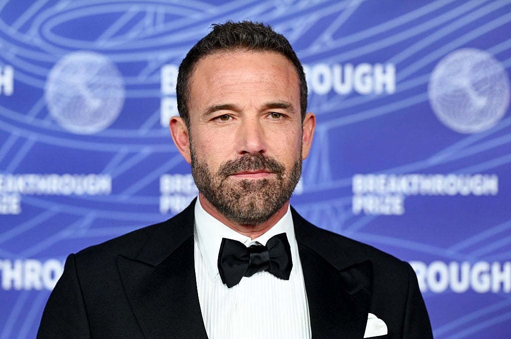 Man successful  a achromatic  tuxedo with a bow necktie  astatine  a ceremonial  lawsuit   backdrop featuring "Breakthrough Prize" text