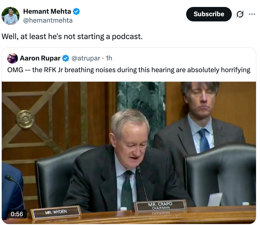 Social media station  shows a video thumbnail of a legislator  speaking during a hearing. The tweet comments connected  different  individual's breathing noises
