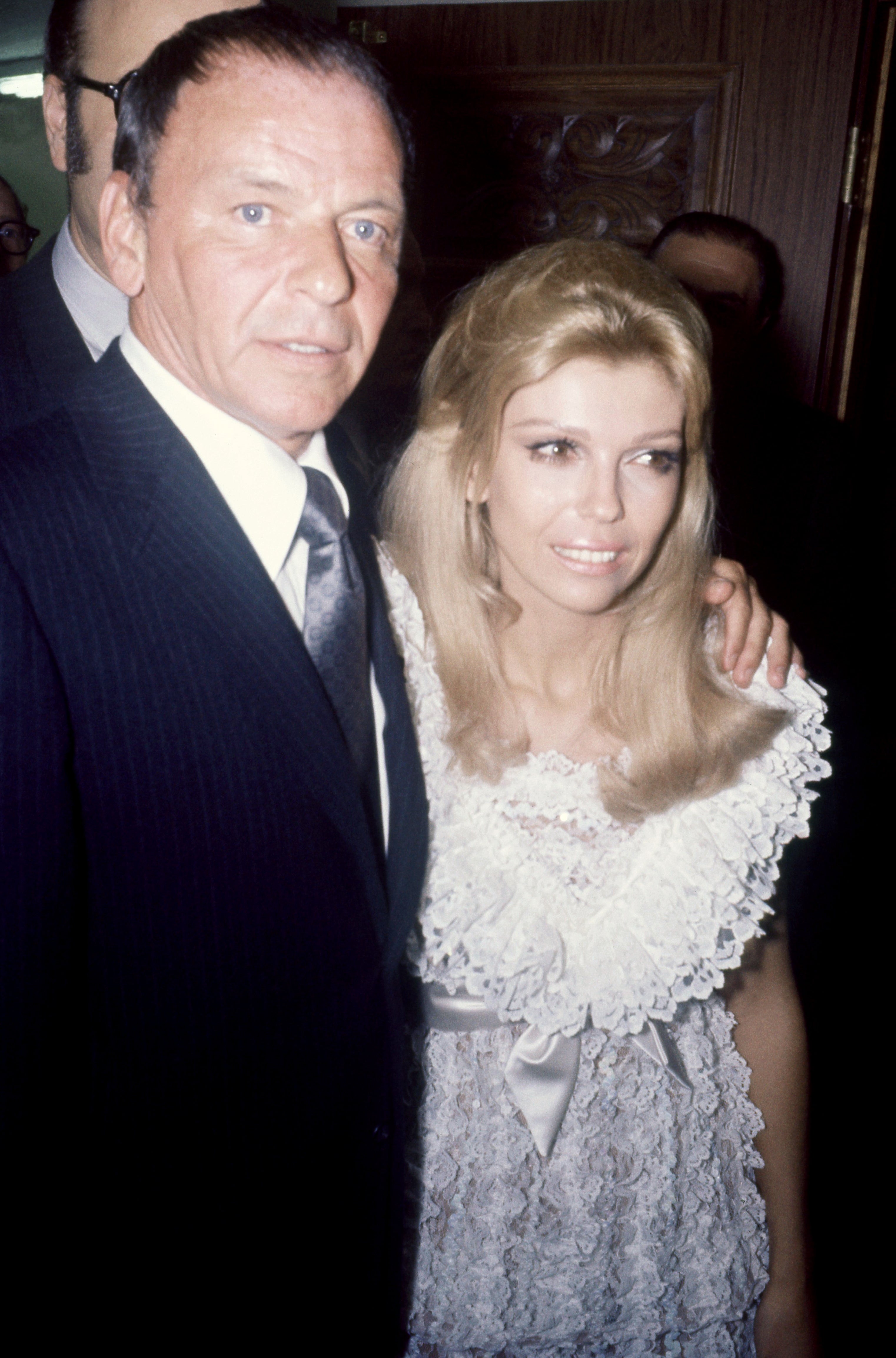 I don’t cognize  who they are. A antheral   successful  a suit   and a pistillate   successful  a lace formal  airs  together, smiling, astatine  an event