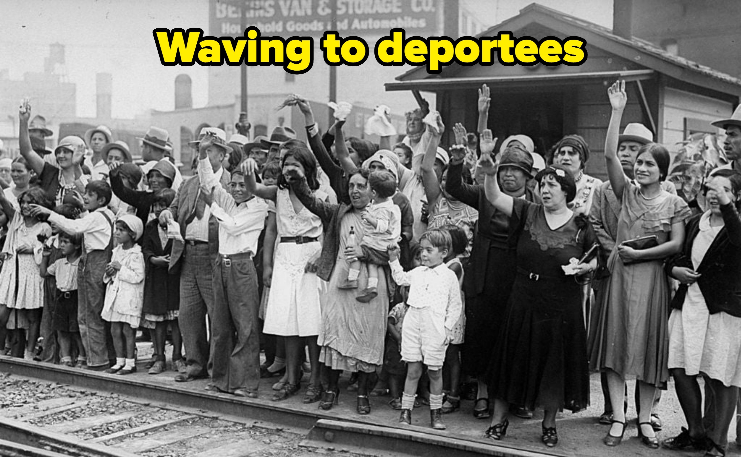 A assemblage  of men, women, and children successful  1920s attire enthusiastically question    their hands astatine  a bid     station, showing excitement and anticipation
