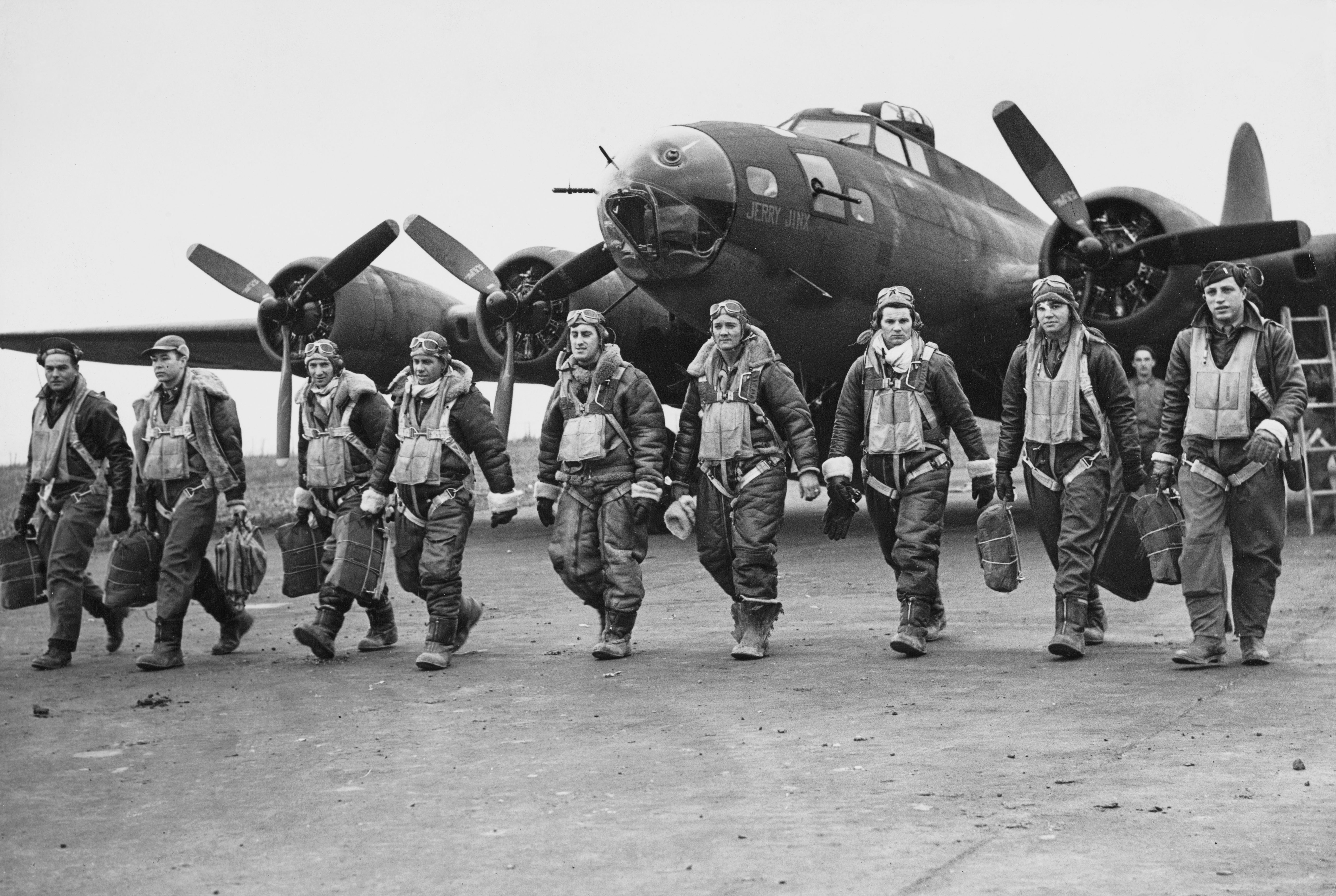 World War II pilots locomotion  with cogwheel  successful  beforehand   of a B-17 bomber, showcasing camaraderie and determination