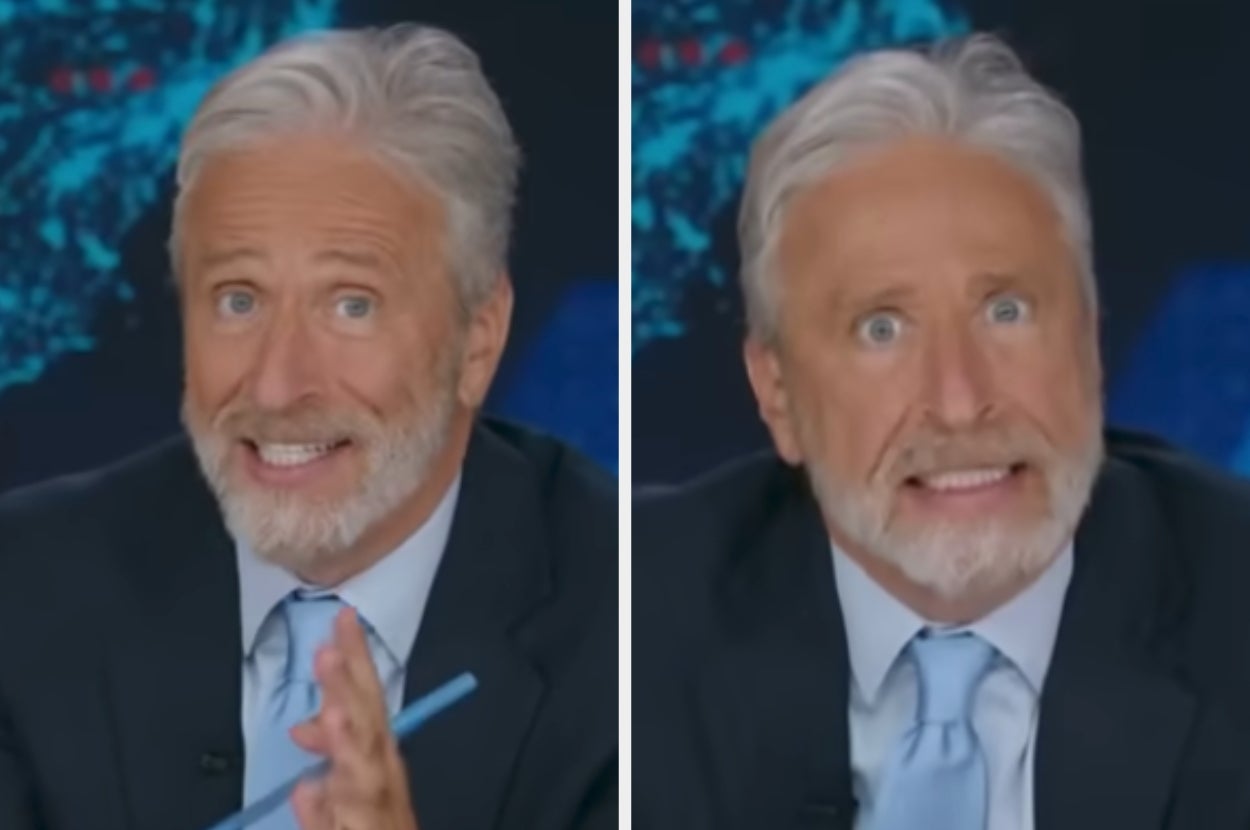 Man with gray hair and beard in a suit making humorous expressions on a TV show set