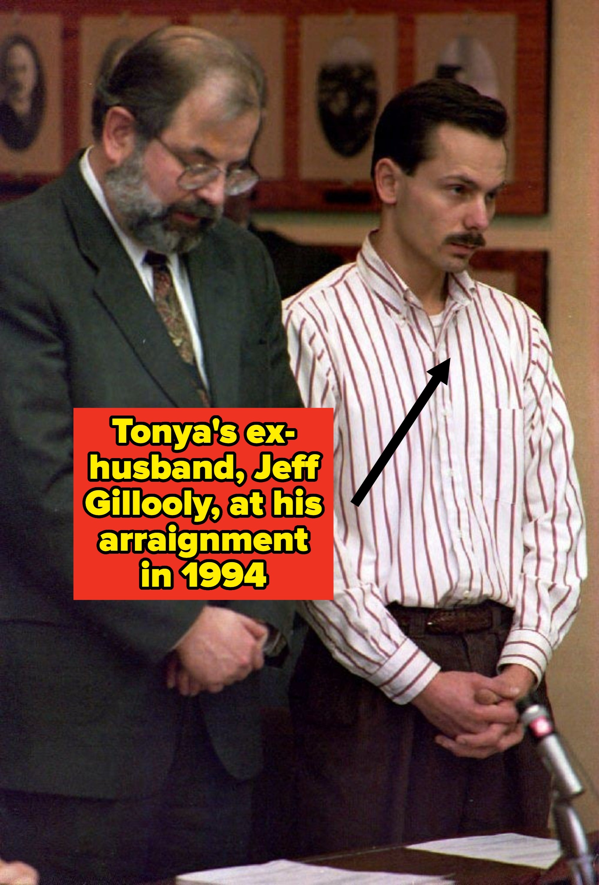 Two men basal   solemnly successful  a room, 1  successful  a suit   and the different   successful  a striped shirt. They look  serious, perchance  during a ceremonial  lawsuit   oregon  announcement