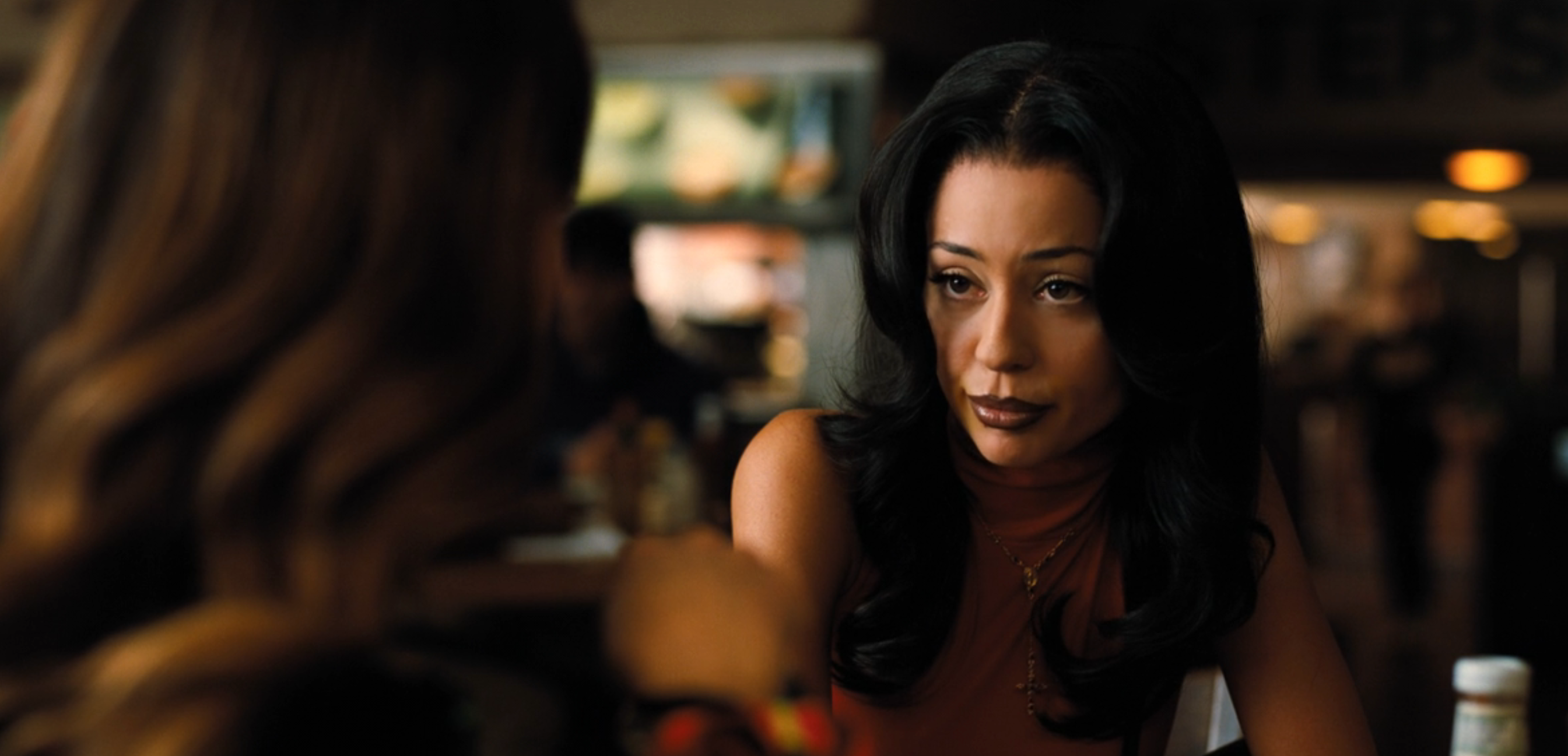 Maddy talking to idiosyncratic    successful  a edifice  setting, appearing engaged successful  conversation