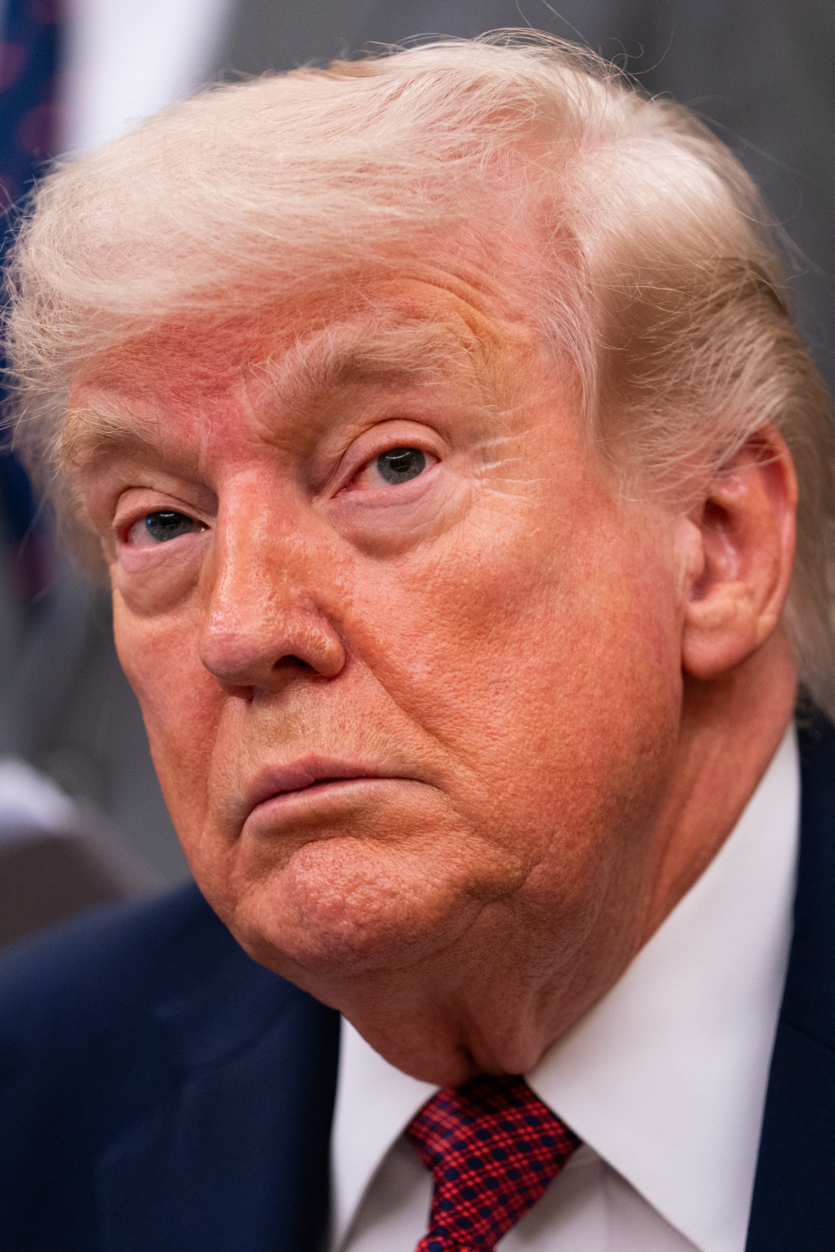 I don't cognize  who this is, but the idiosyncratic   is looking straight  astatine  the camera with a neutral expression, dressed successful  a suit   and tie