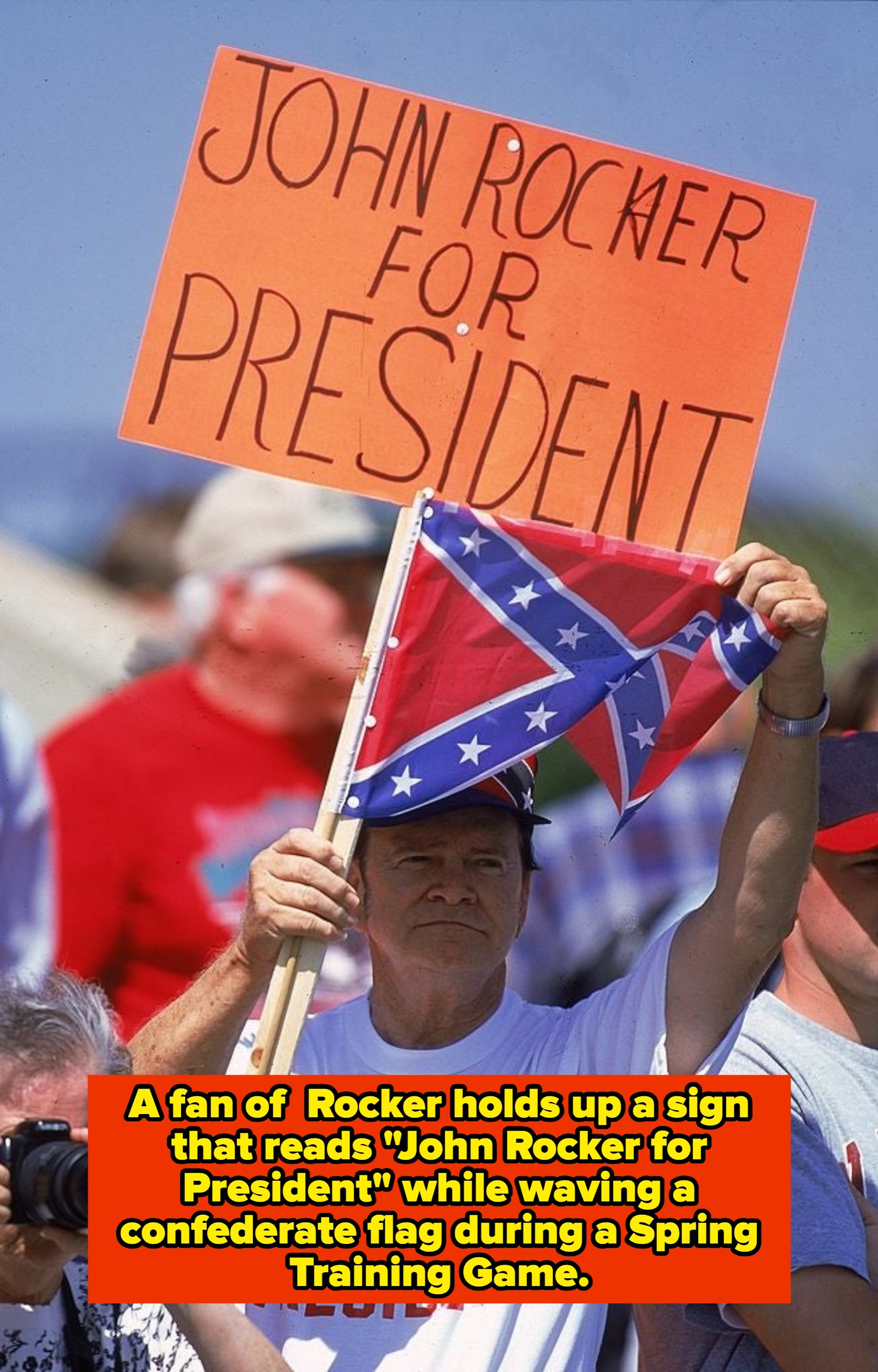 Person holding a "John Rocker for President" motion   and a emblem  astatine  a sports-related event