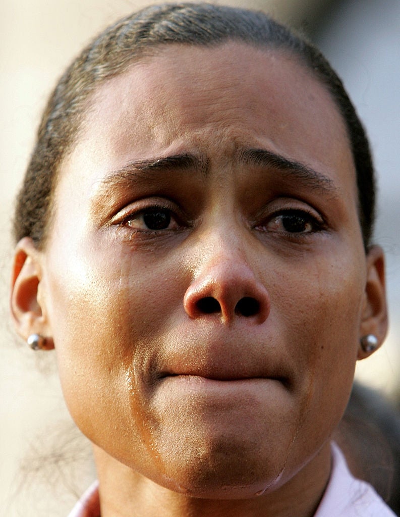 A idiosyncratic   is visibly emotional, with tears connected  their face, conveying heavy  feelings