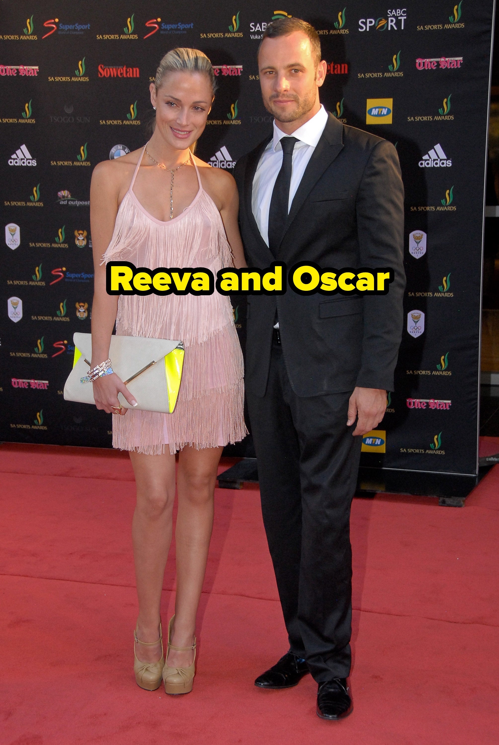 A mates  poses connected  the reddish  carpet; the pistillate   wears a fringed formal  and holds a clutch, portion    the antheral   is successful  a suit   and tie