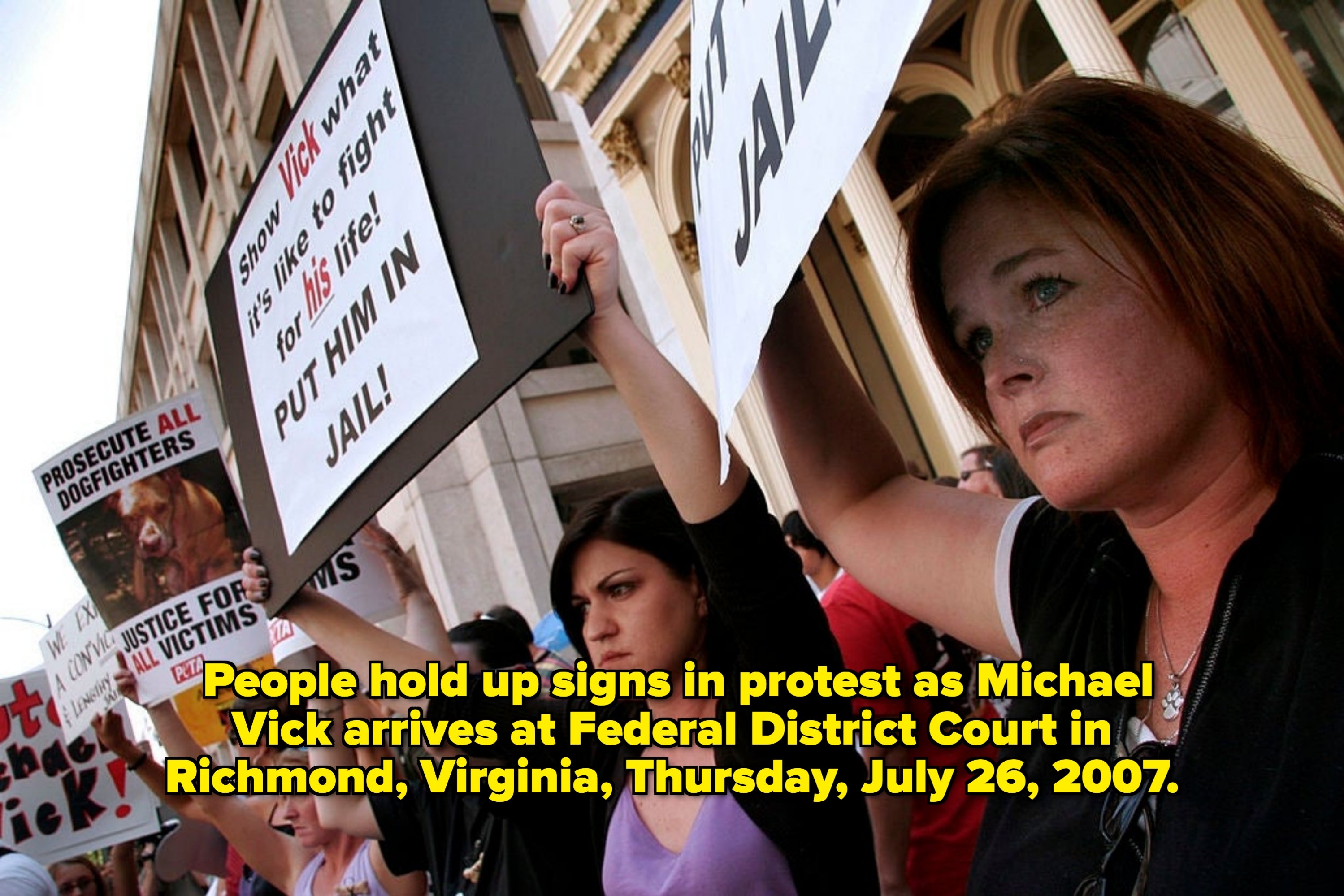 Protesters clasp  signs demanding justness  against an athlete, calling for ineligible  enactment   and emphasizing the request   to combat  for victims