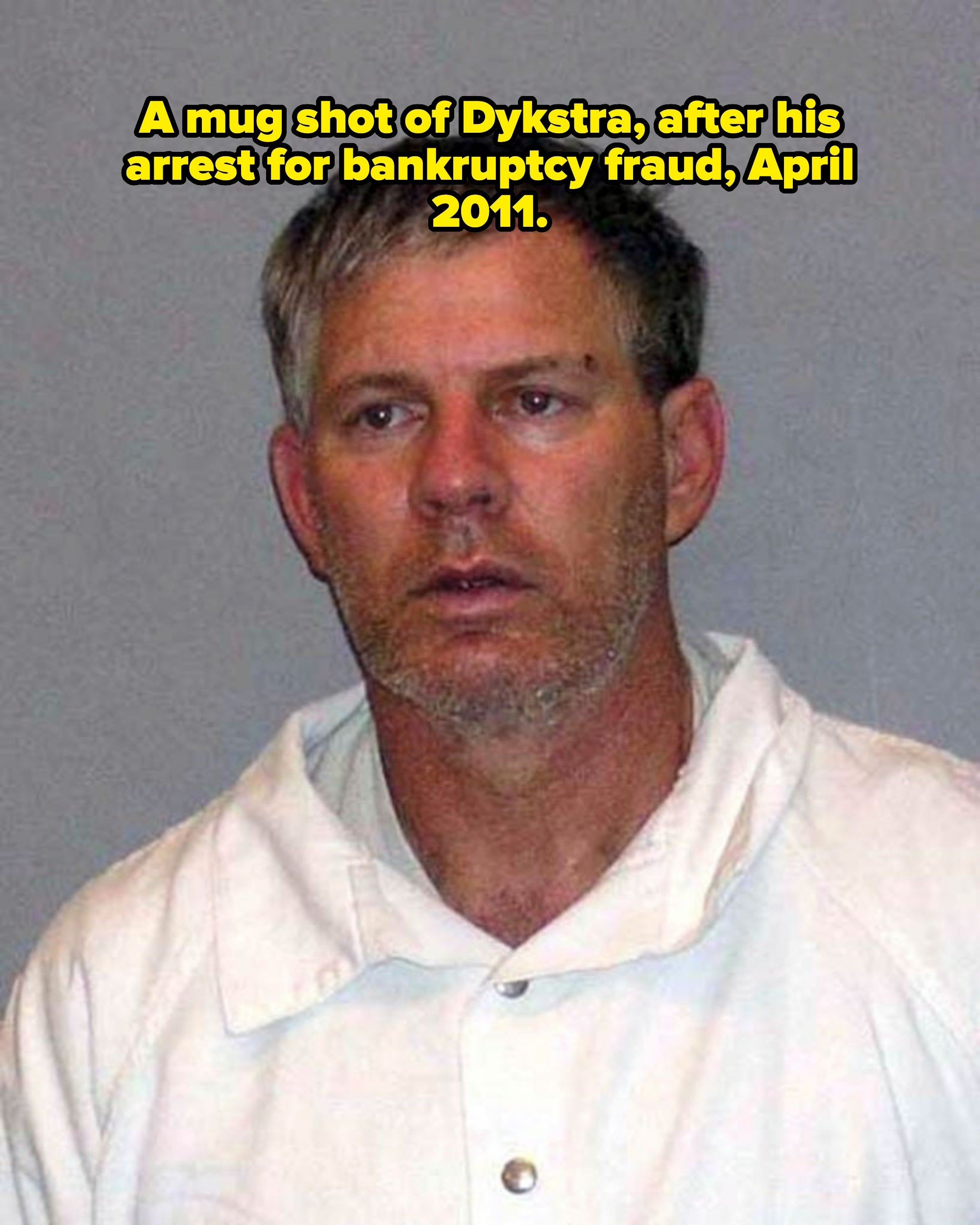 A antheral   with abbreviated  hairsbreadth  and stubble, wearing a casual collared shirt, looking somewhat  disheveled