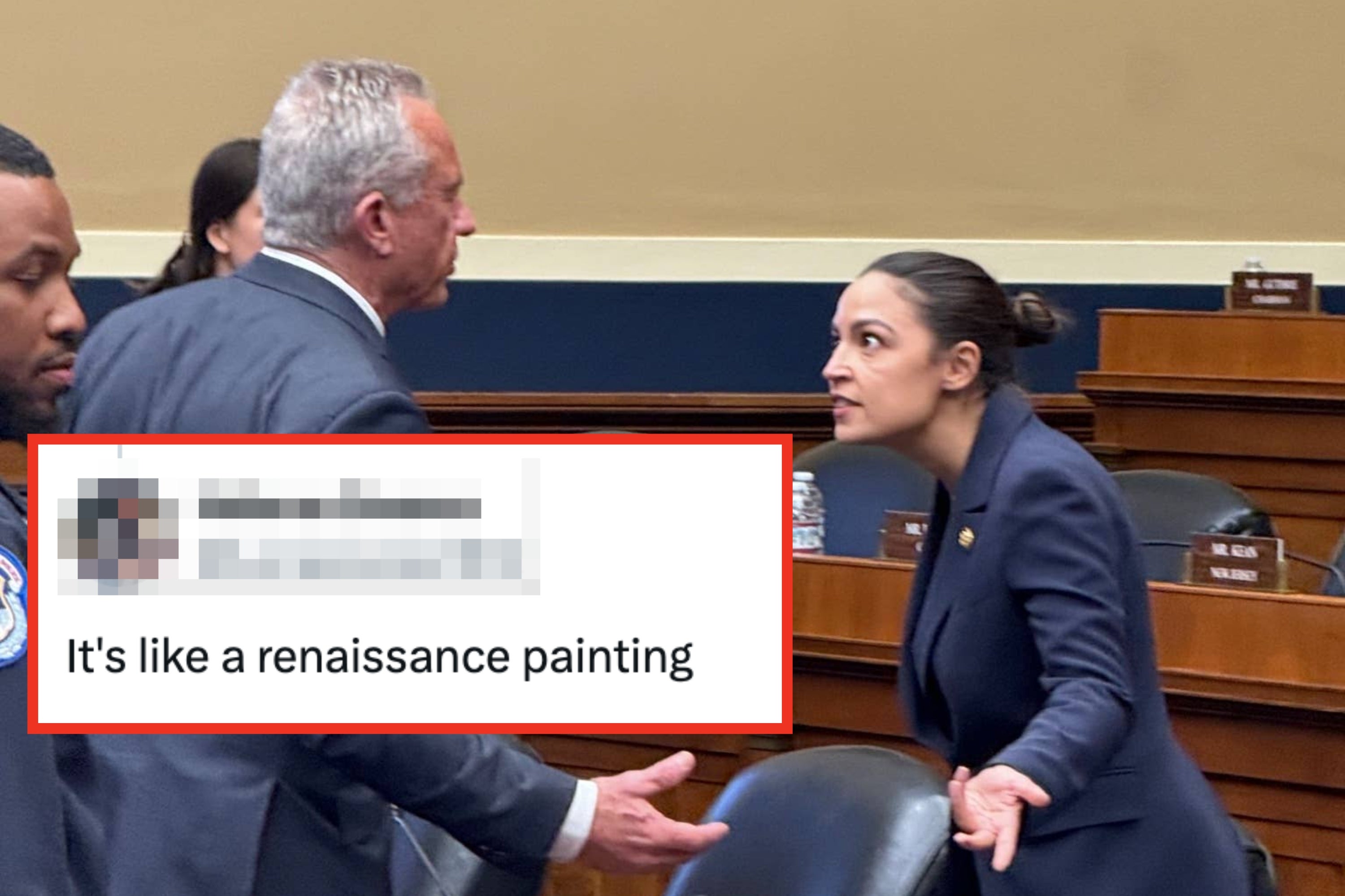 People in a government hearing room engaging in discussion, with portraits on the wall behind them