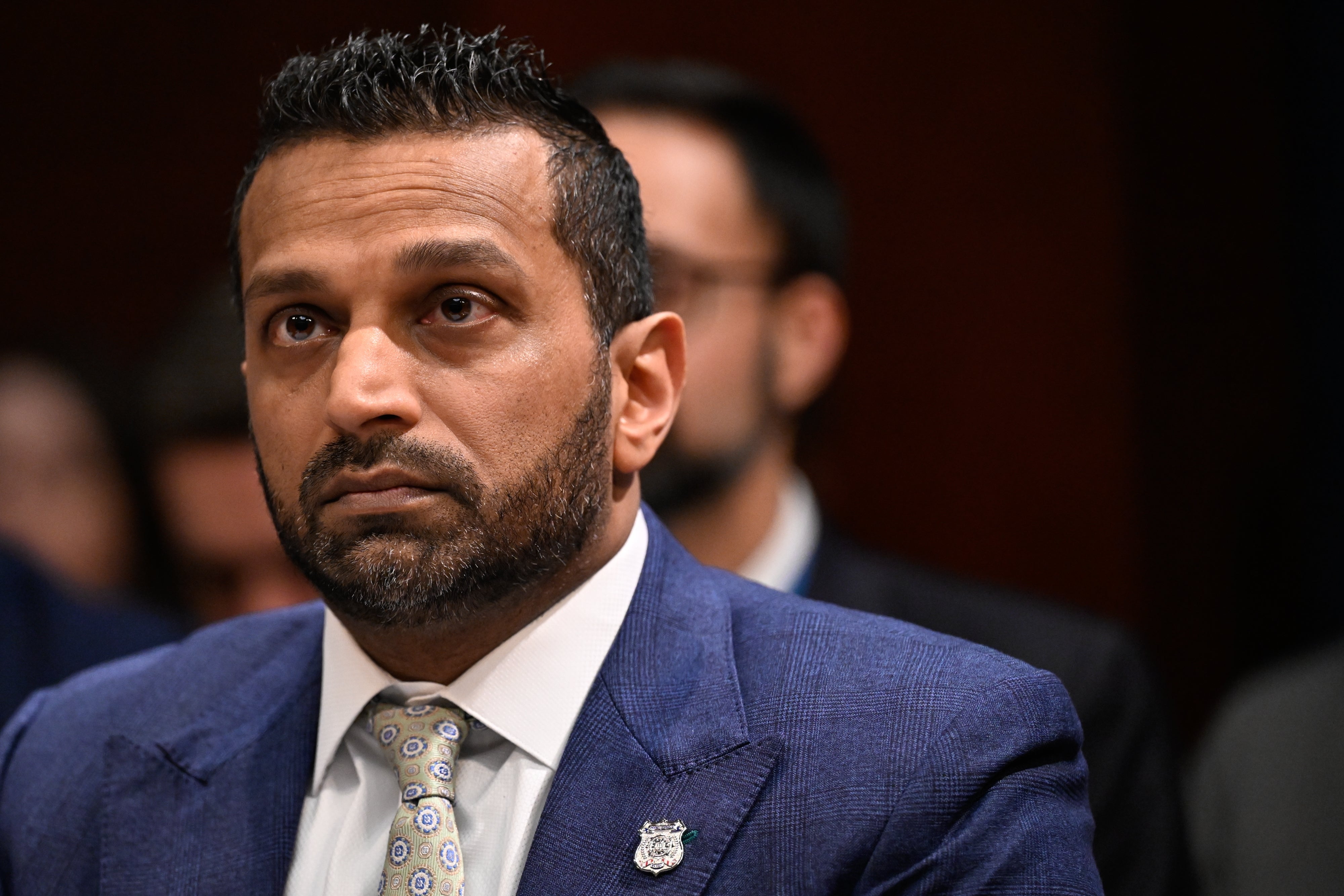 A idiosyncratic   successful  ceremonial  attire with a patterned necktie  successful  a superior   expression, appearing to beryllium  successful  a nonrecreational  setting