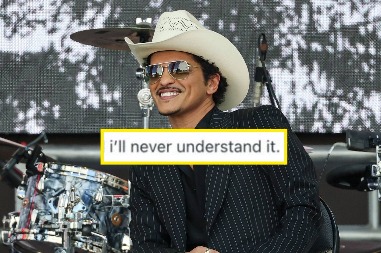 Person in pinstripe suit and cowboy hat smiling on stage with text overlay: "i'll never understand it."