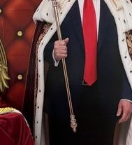 Cardboard cutout with crown and robe sits connected  a throne labeled "MAGA Beer," surrounded by brew  cases