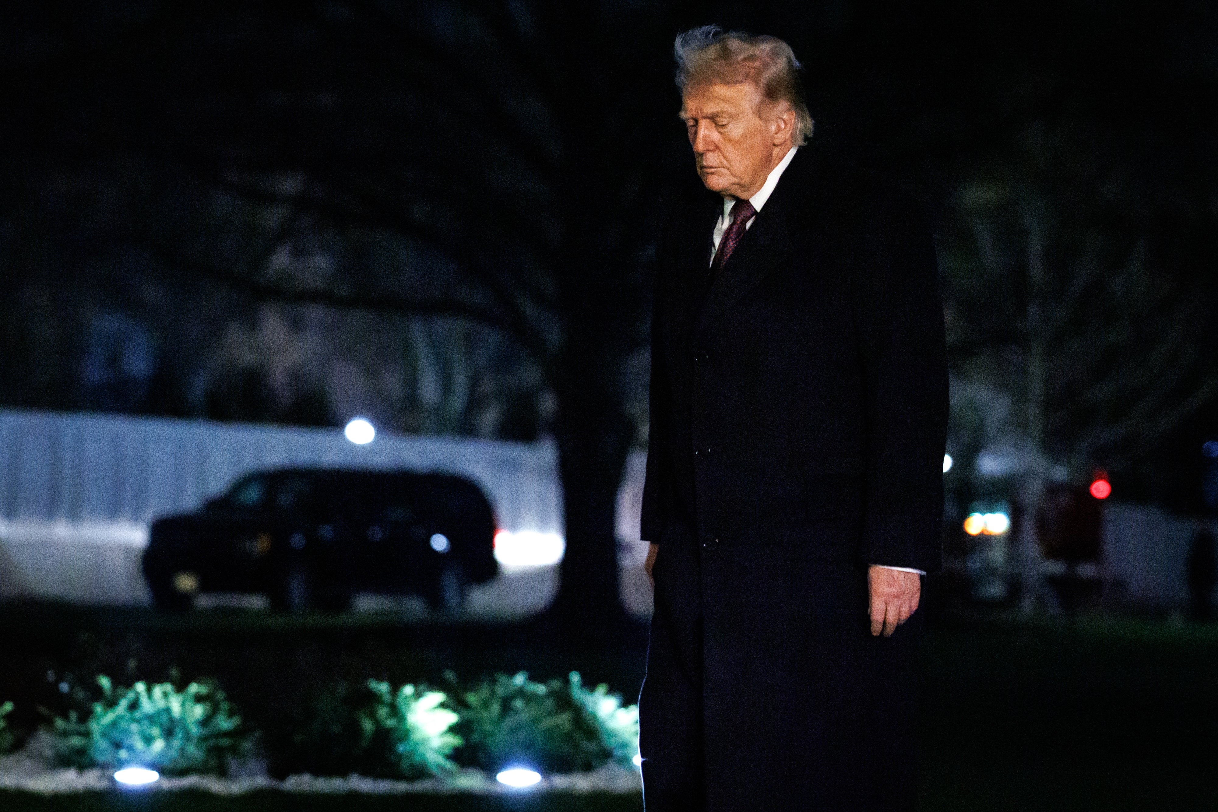 Person successful  a ceremonial  overgarment  walking unsocial  outdoors astatine  night