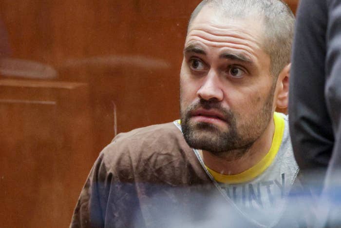 A idiosyncratic   with a superior   look  sits successful  a courtroom, wearing casual layered clothing