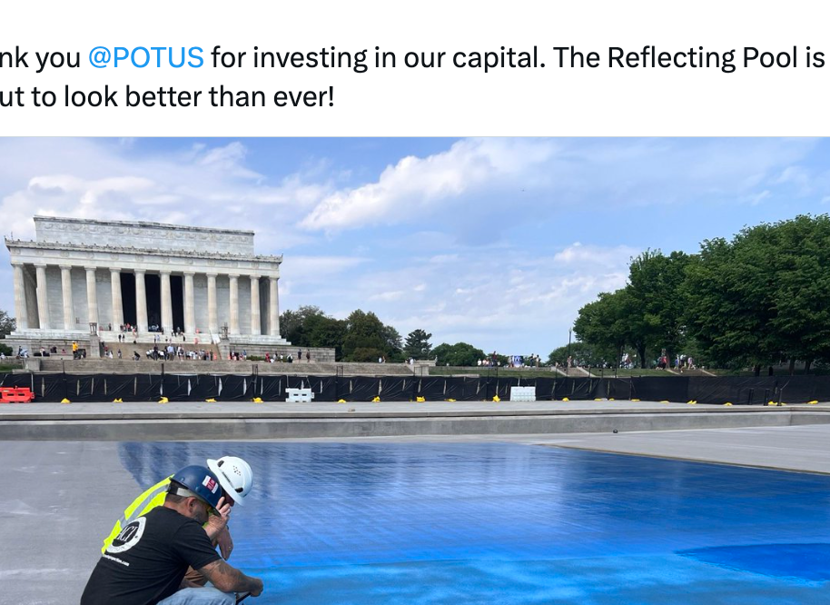 Worker paints pavement adjacent   the Lincoln Memorial, improving the Reflecting Pool area