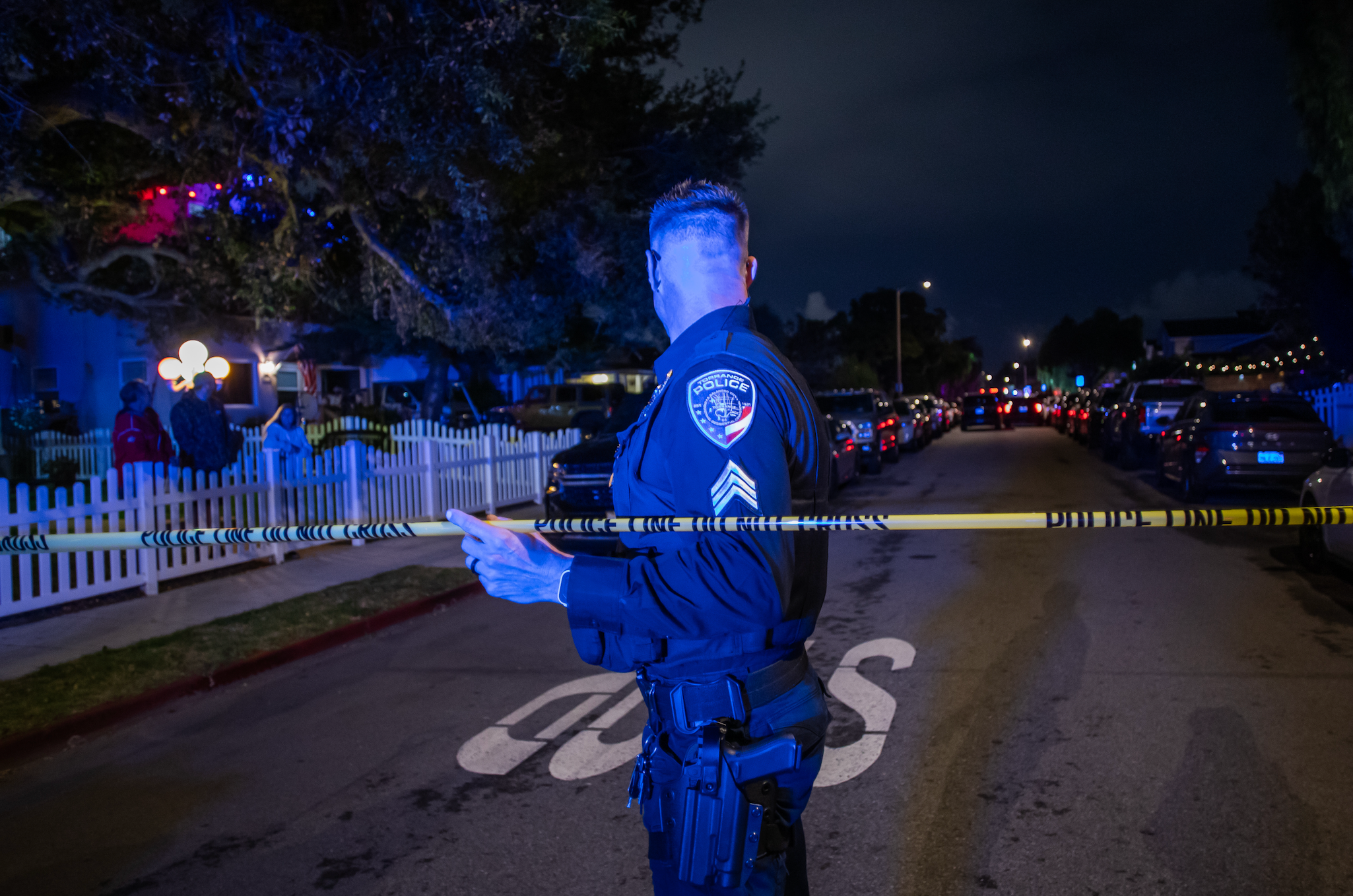 Police serviceman  stands down  caution portion    connected  a thoroughfare  astatine  night, securing the area