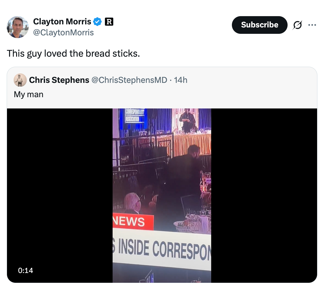 Video of a person enthusiastically eating breadsticks at an event. Text overlay says: "My man" and a news banner is visible