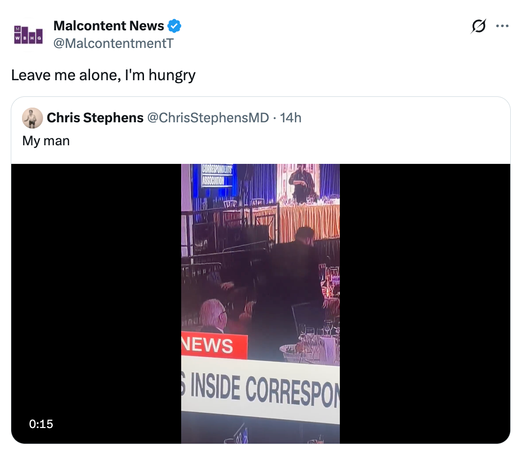 Man walks on stage during a news broadcast event; caption jokes "Leave me alone, I'm hungry."