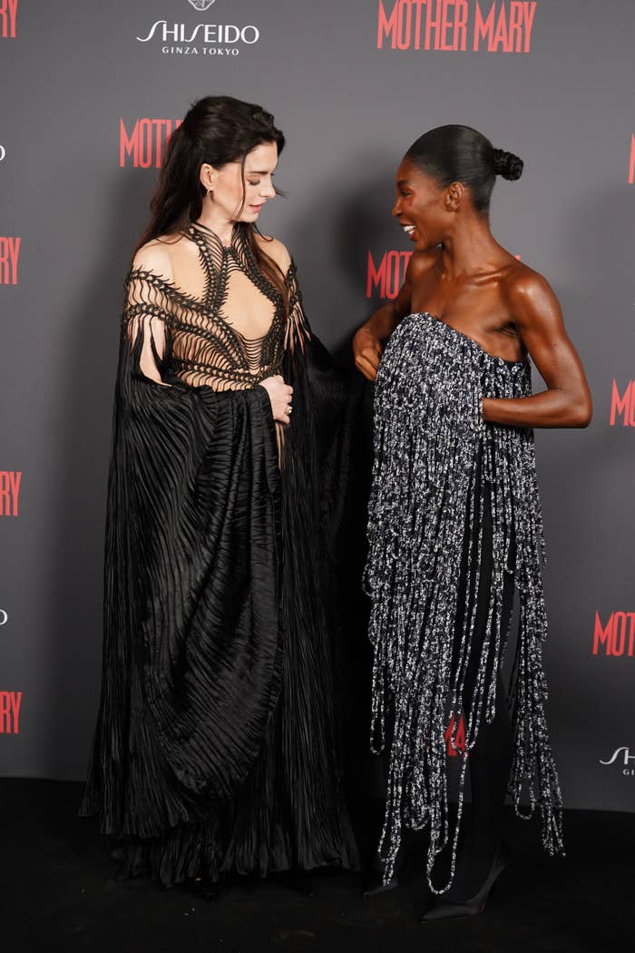 Anne Hathaway looks astatine  Michaela Coel connected  the reddish  carpet arsenic  Michaela fixes her top