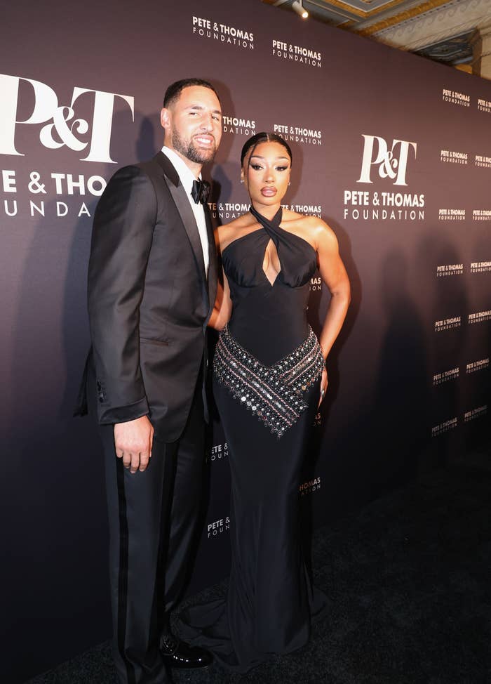 Megan Thee Stallion and Klay Thompson successful  ceremonial  outfits connected  the reddish  carpet