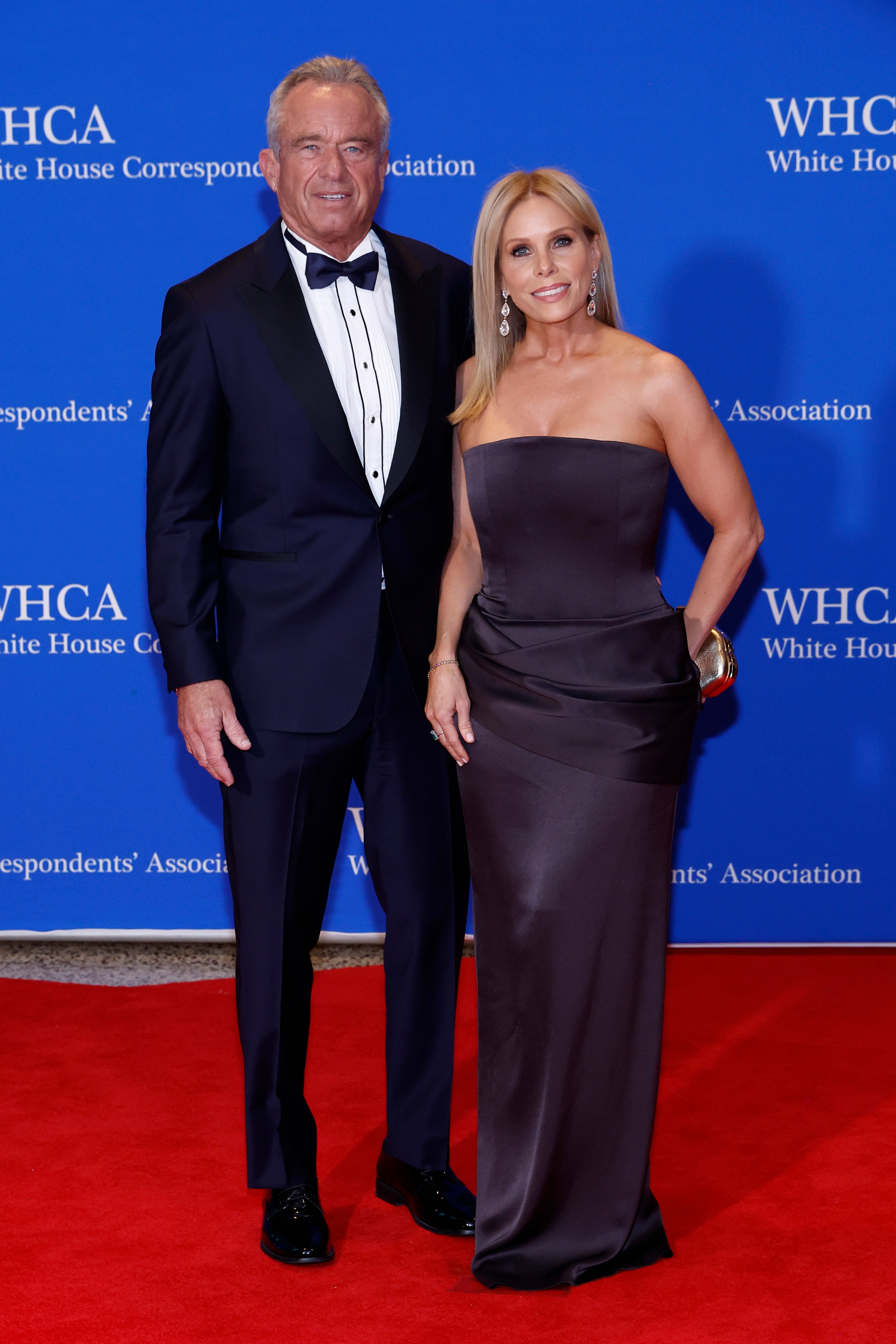 Two individuals airs  unneurotic  connected  the reddish  carpet astatine  the White House Correspondents' Association event. One wears a tuxedo, and the different   wears a strapless gown