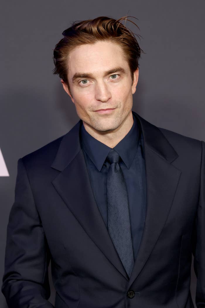 Robert Pattinson in sleek suit, formal setting