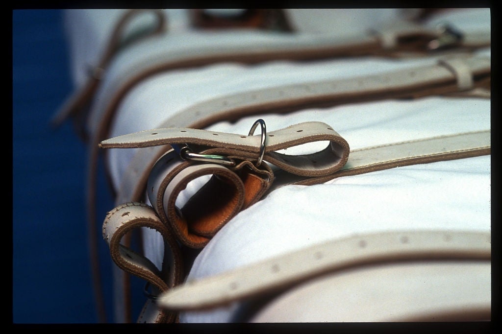 Close-up of leather straps and buckles connected  a level  surface, suggesting a aesculapian  oregon  organization  setting