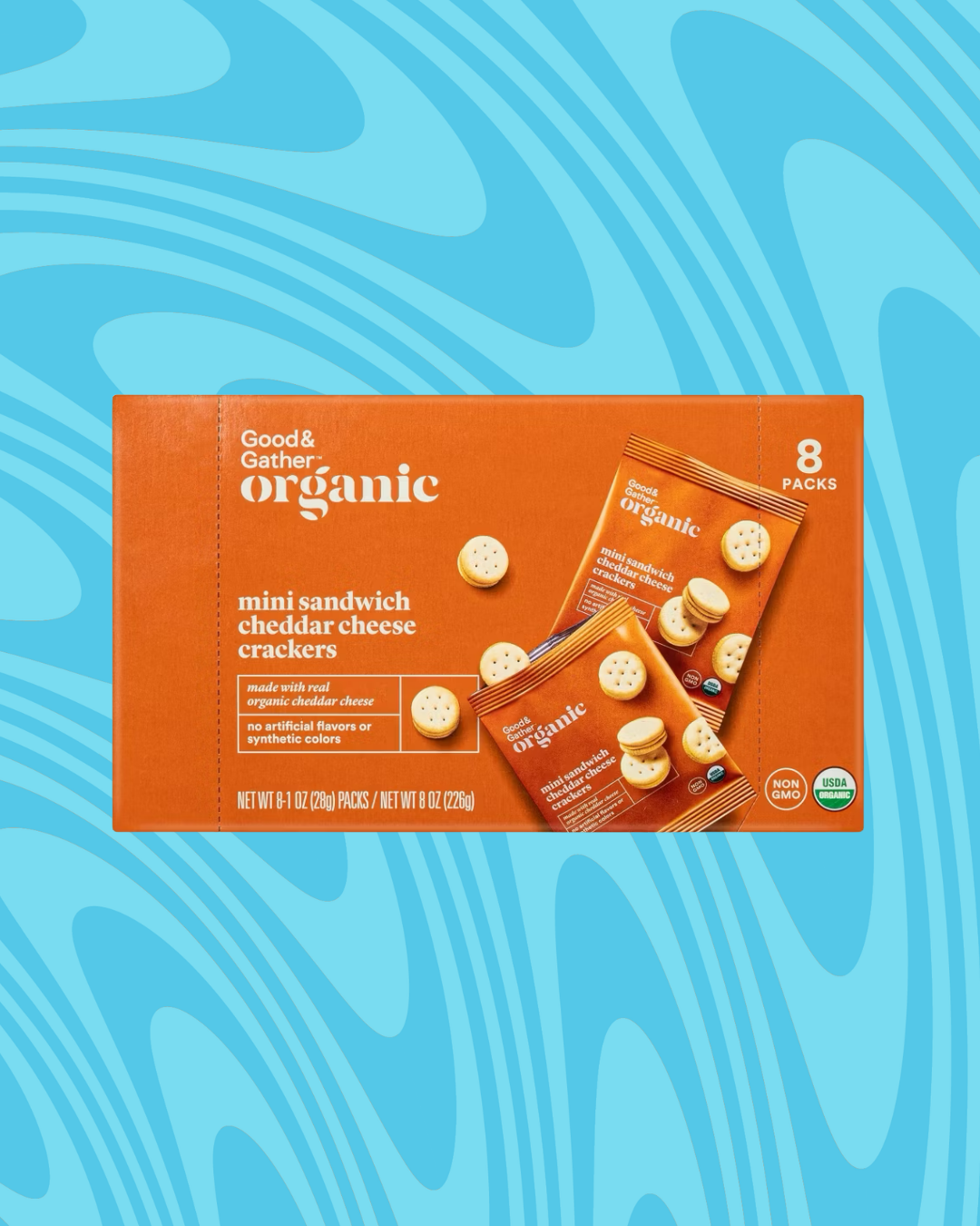 Box of Good &amp;amp; Gather Organic mini sandwich cheddar cheese crackers, 8 packs, displayed on a blue patterned background