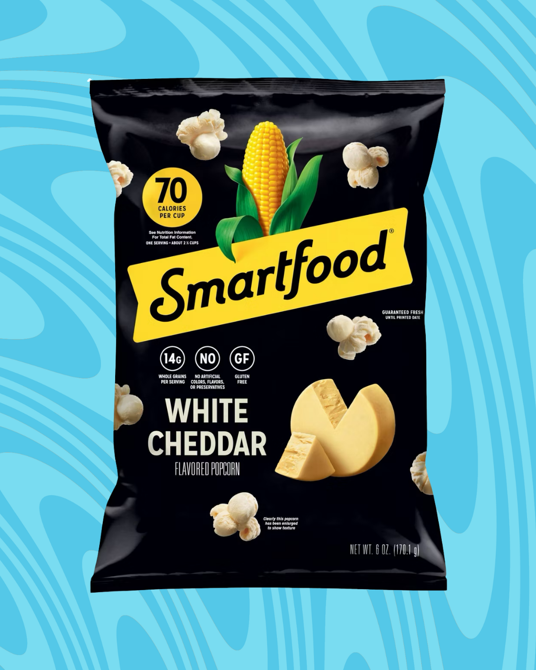Smartfood White Cheddar popcorn bag with nutritional info: 70 calories per cup, 14g whole grain, no artificial flavors, gluten-free