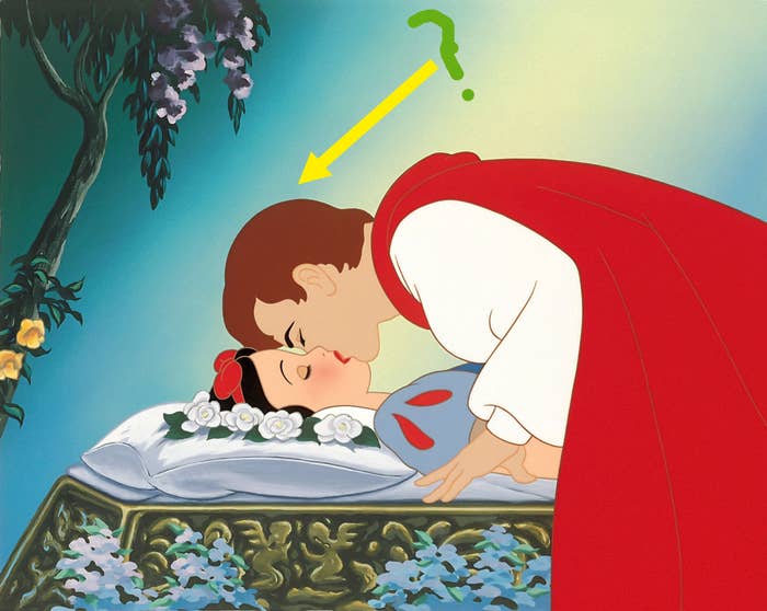 A prince leans implicit    to buss  Snow White, who lies sleeping connected  a floral-decorated furniture  successful  a wood  setting