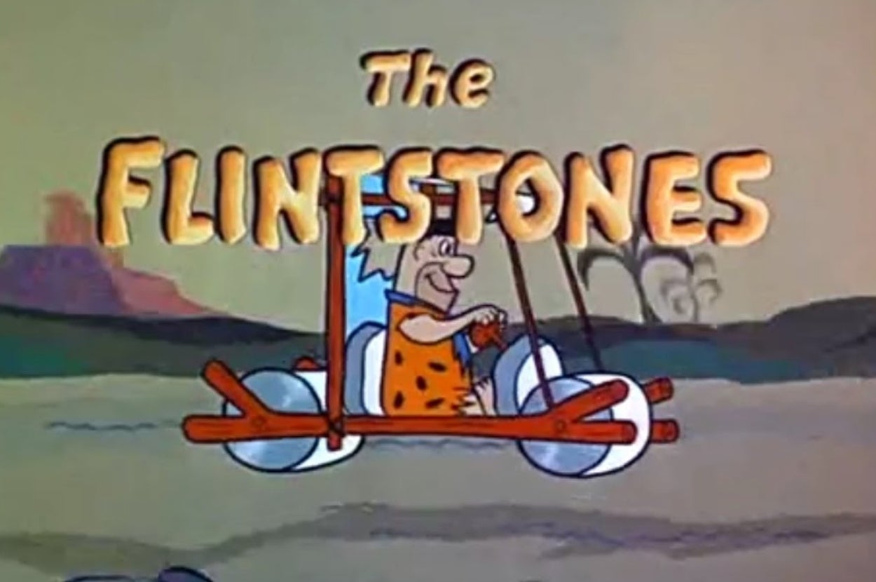 Animated title card for "The Flintstones," featuring Fred Flintstone driving a stone-age vehicle